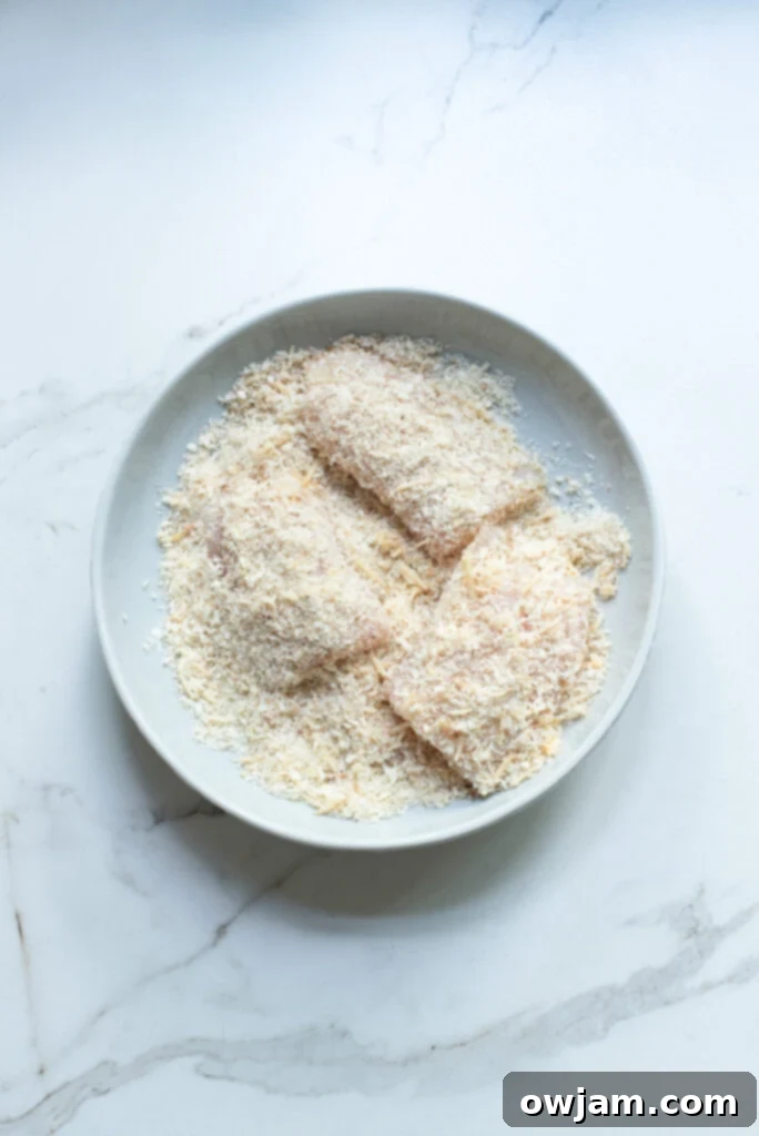 Quick Crispy Skillet Fish 6 Easy Pan Fried Fish: Fish fillet coated in breadcrumbs, ready for frying.