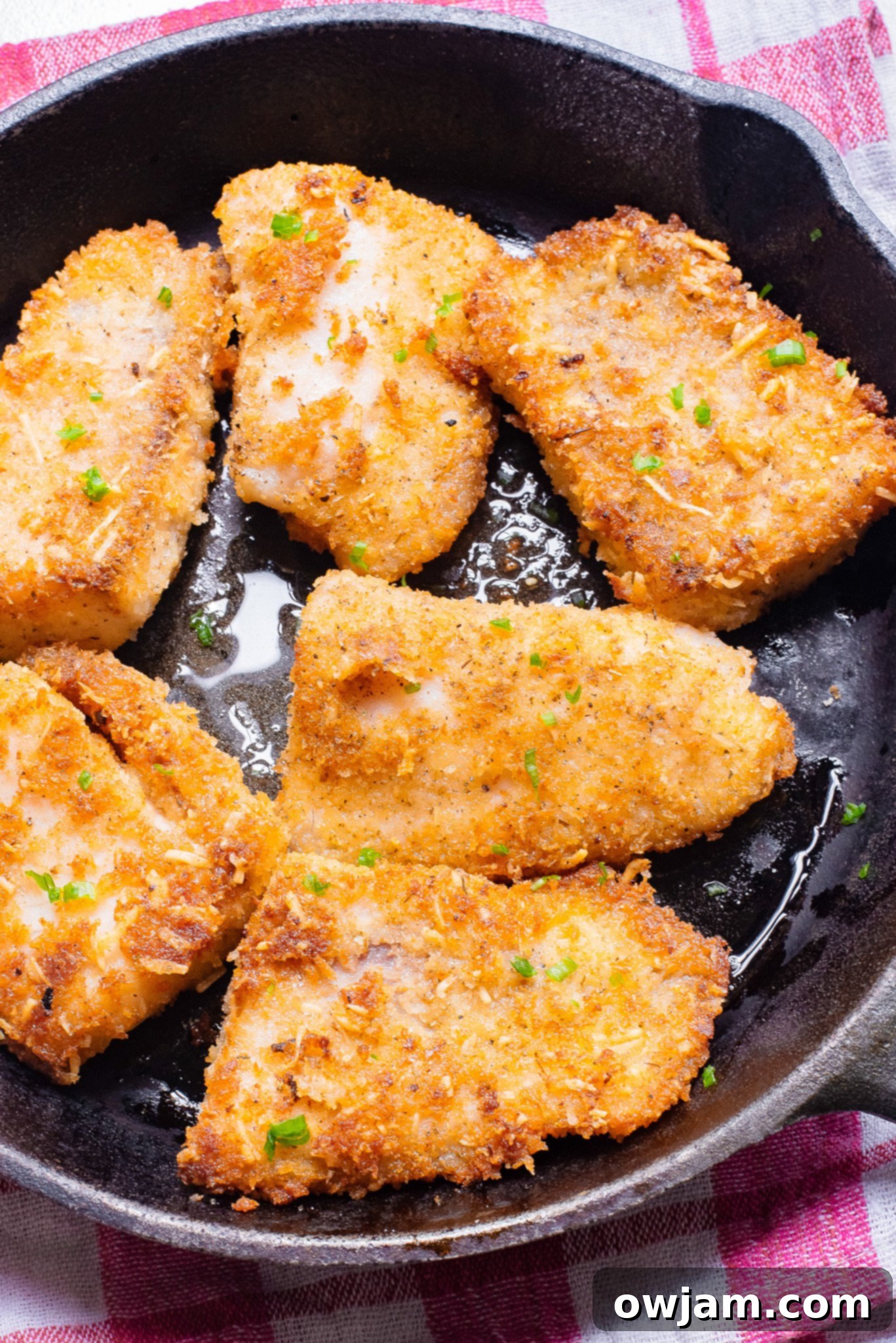 Quick Crispy Skillet Fish 7 Easy Pan Fried Fish cooking in a hot skillet, showing golden-brown crust.