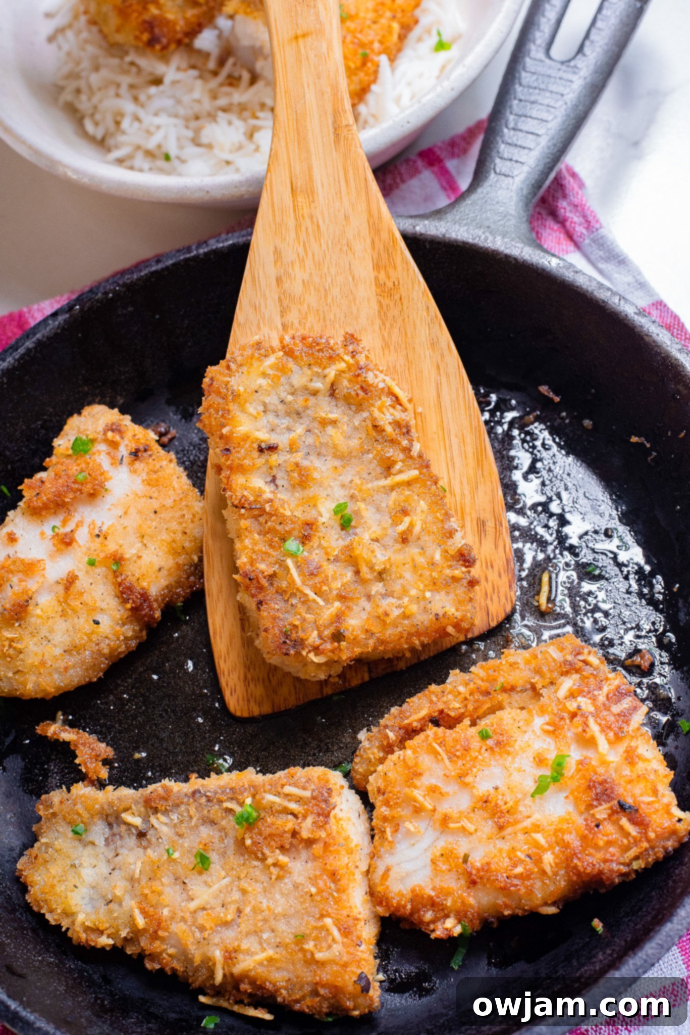 Quick Crispy Skillet Fish 8 Easy Pan Fried Fish in a skillet, ready to be served.