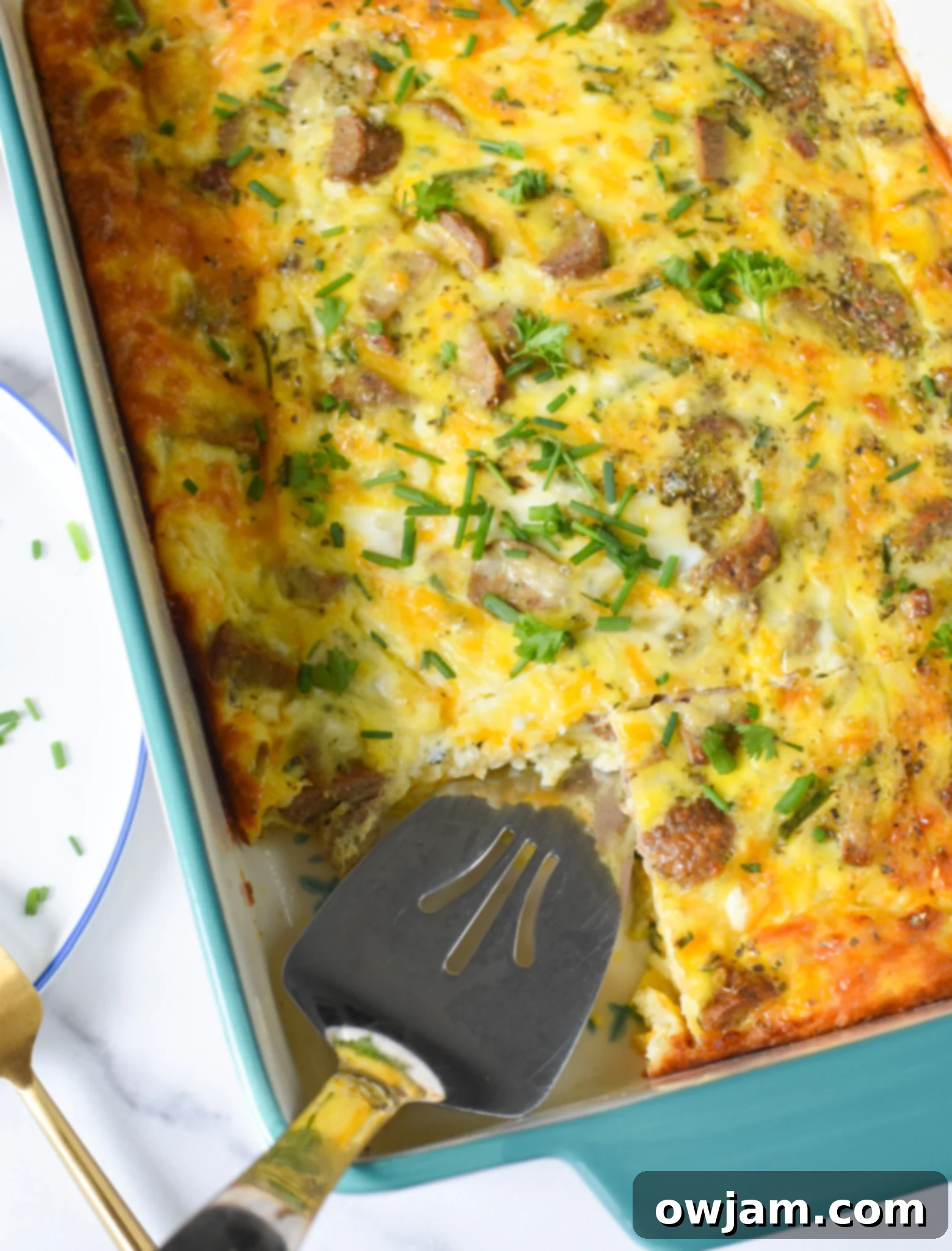 Cheese and Sausage Baked Eggs in a large casserole dish, ready to be served.