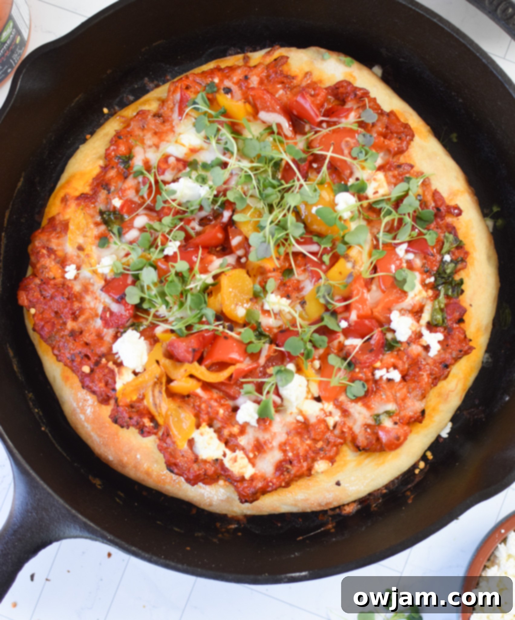 Rustic Cast Iron Mediterranean Pizza 3 Cast Iron Mediterranean Pizza cooked in a cast iron skillet, ready to be served.