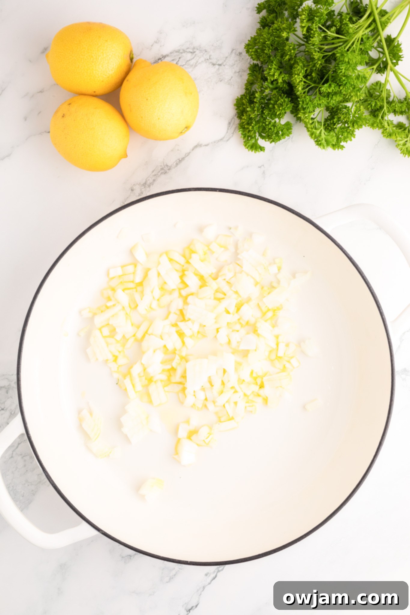 Zesty Lemon Ricotta Pasta 6 Finely diced shallots are cooking in a skillet with olive oil, a crucial first step for building the pasta sauce's flavor.