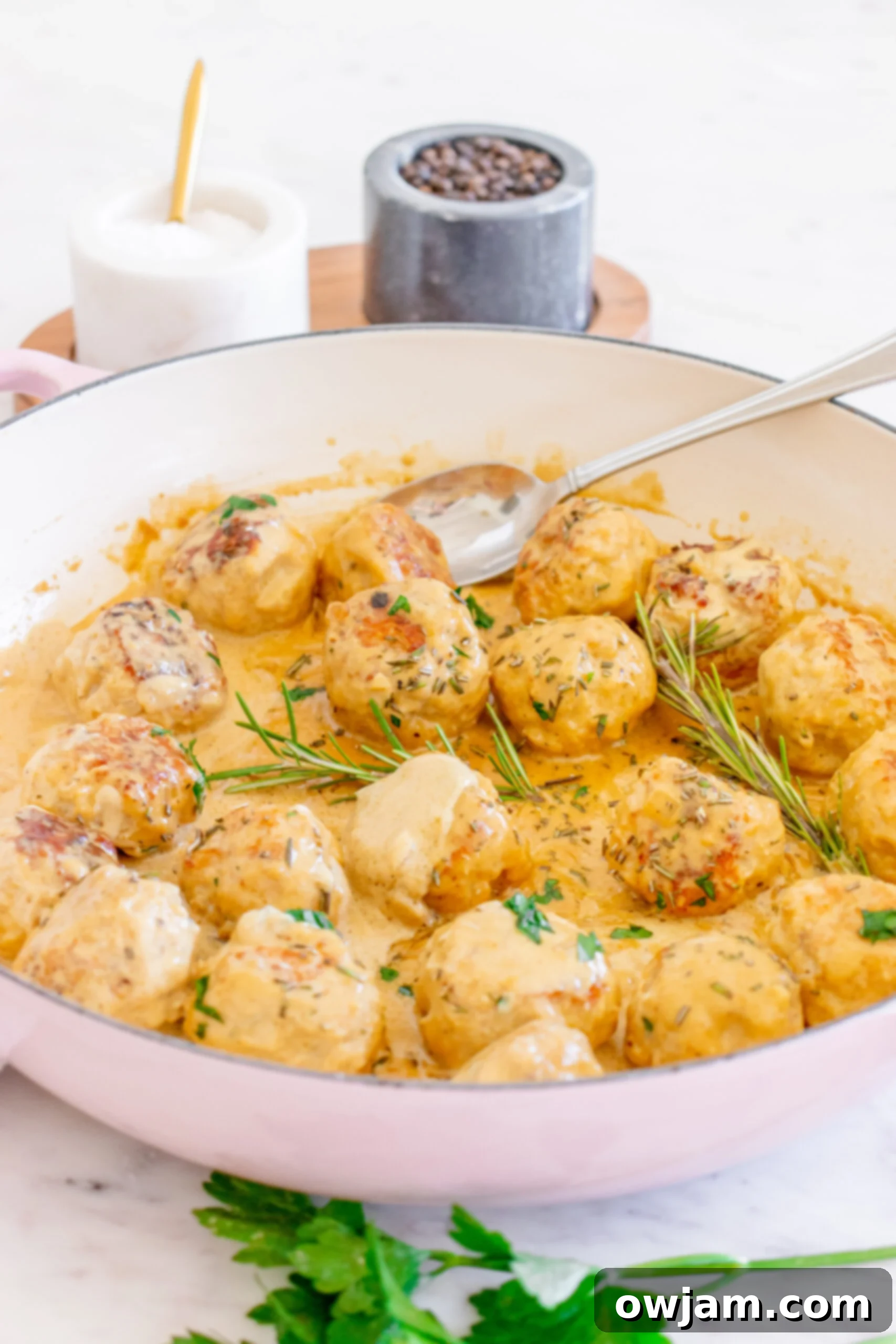 Maple Dijon Turkey Meatballs 2 Maple Dijon Turkey Meatballs in a pot, ready to be served, highlighting their creamy sauce.