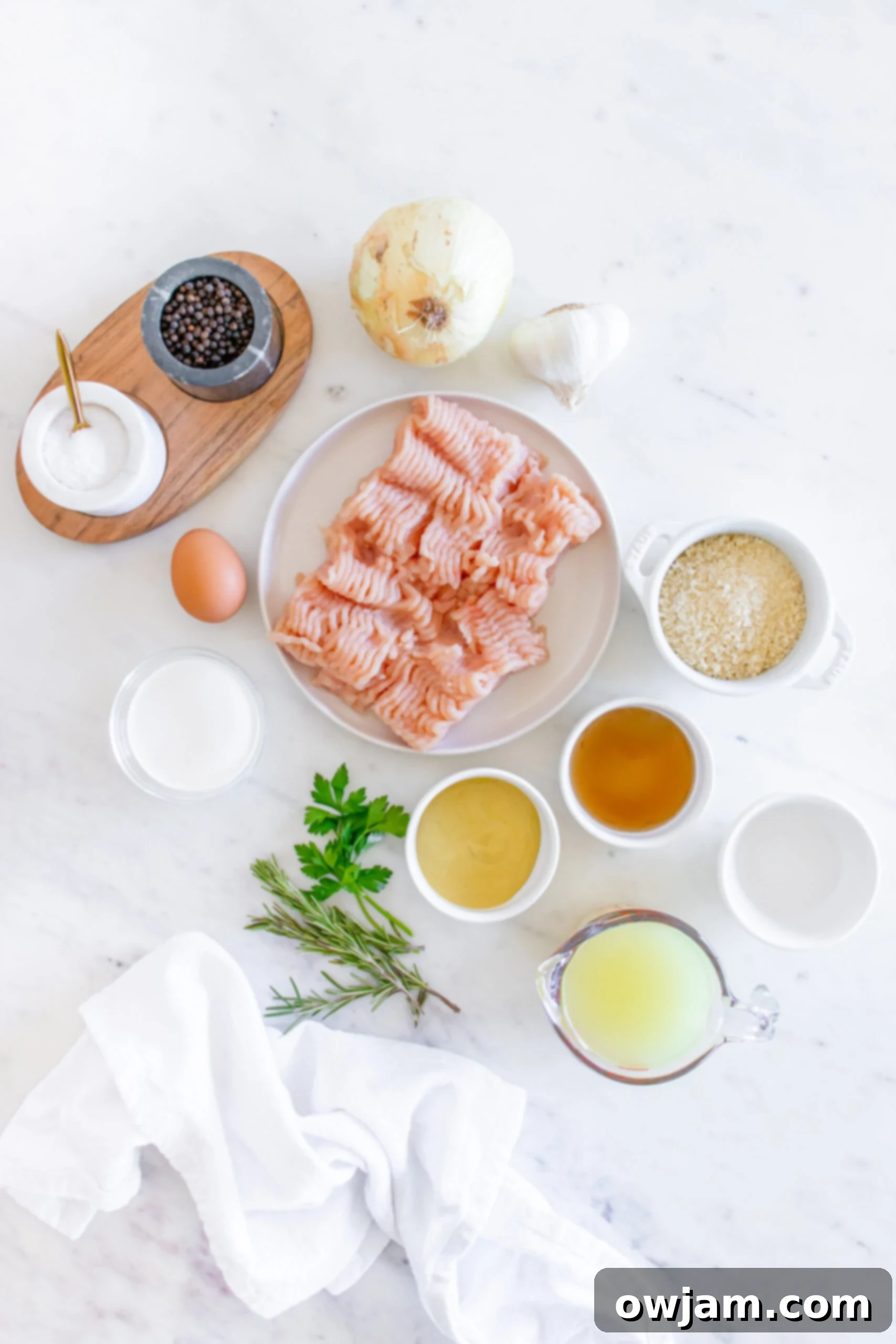 Sweet & Savory Maple Dijon Turkey Meatballs 4 All the fresh ingredients for Maple Dijon Turkey Meatballs laid out on a cutting board.