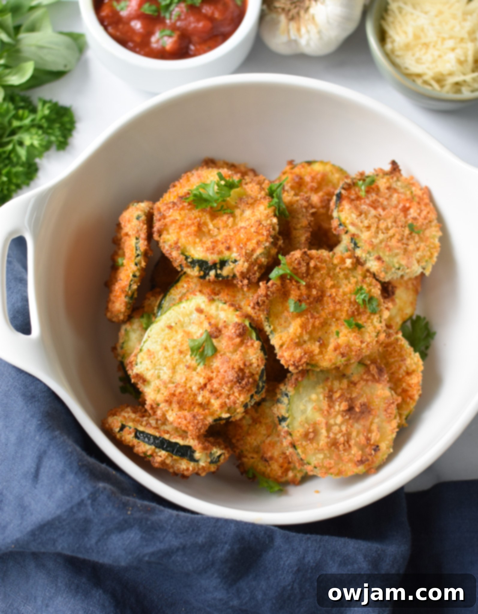 Crispy Air Fryer Zucchini Chips 10 Crispy Air Fryer Zucchini Chips in a bowl with a logo.