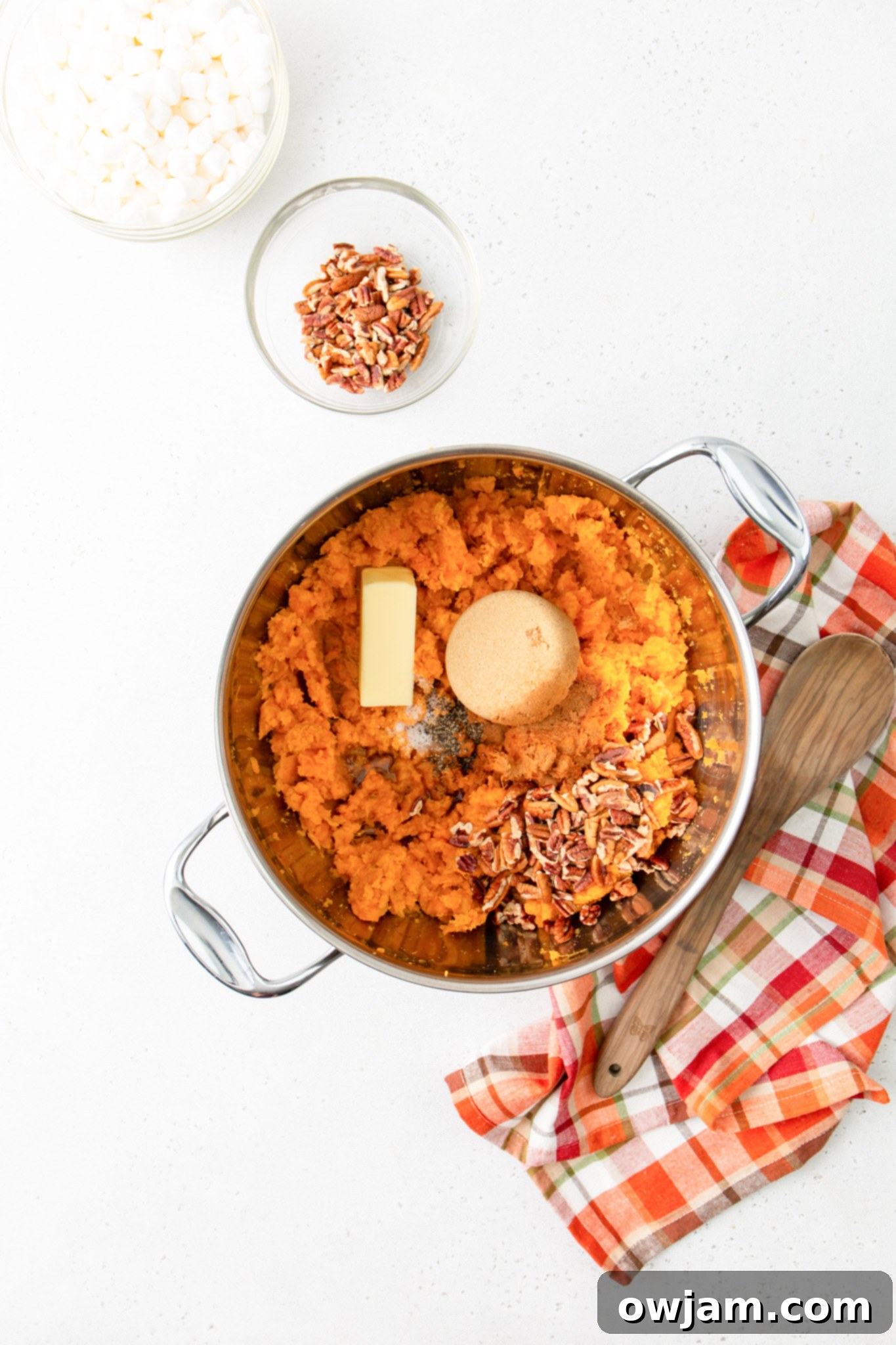 Golden Sweet Potato Marshmallow Bake 8 Sweet Potato Casserole with Marshmallows butter in pot