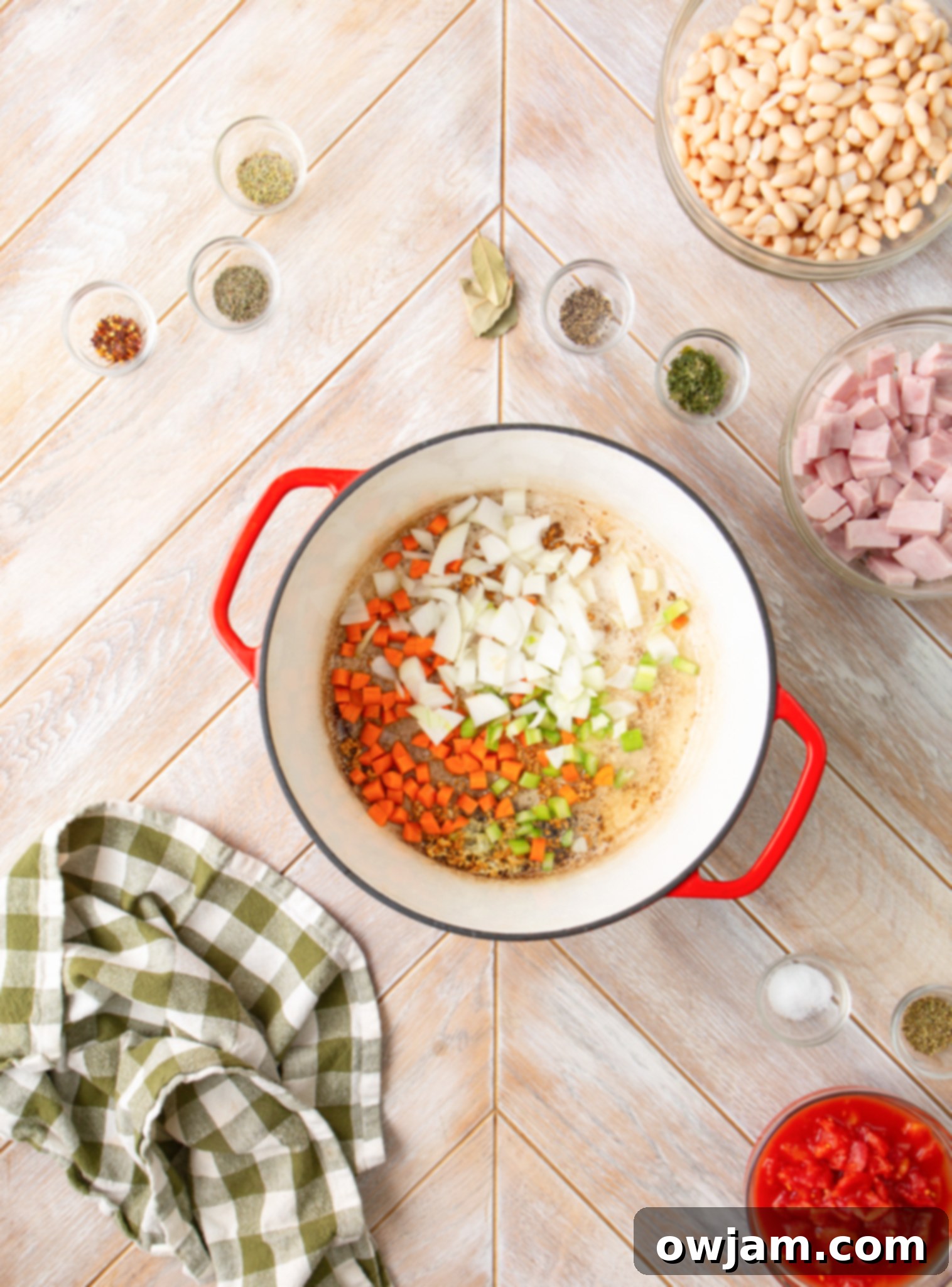 Navy Bean Soup Recipe vegetables sautéing in a pot, building the flavor base