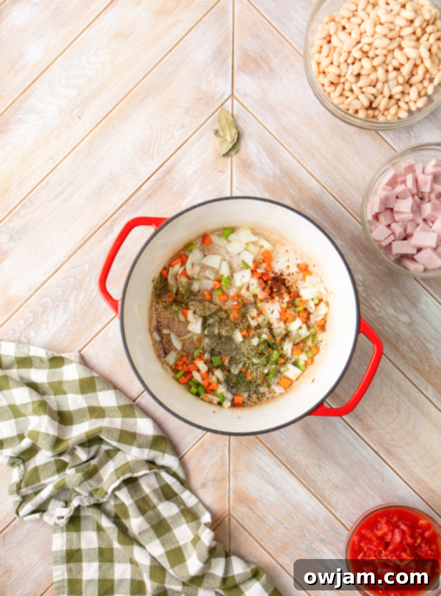 Navy Bean Soup Recipe with spices being added to the pot