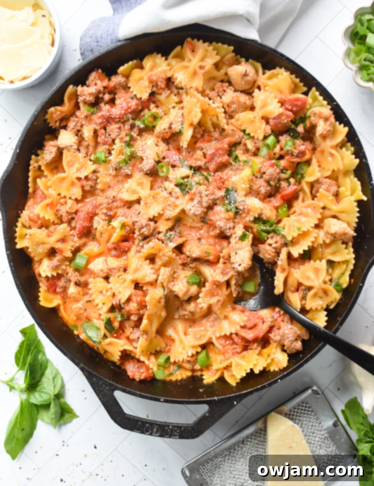 Creamy Chicken and Chorizo Pasta Recipe in a cast iron skillet.