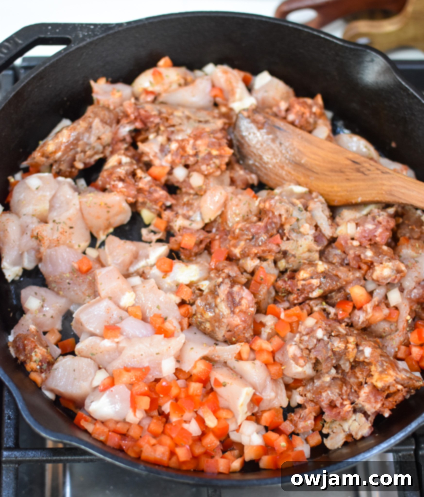 Creamy Chicken and Chorizo Pasta Recipe in a cast iron skillet. 