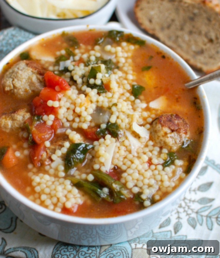 Classic Italian Wedding Soup 5 A serving of Italian Wedding Soup with fresh Parmesan garnish
