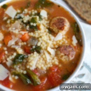 Classic Italian Wedding Soup 7 A bowl of Italian Wedding Soup with turkey meatballs, greens, and small pasta