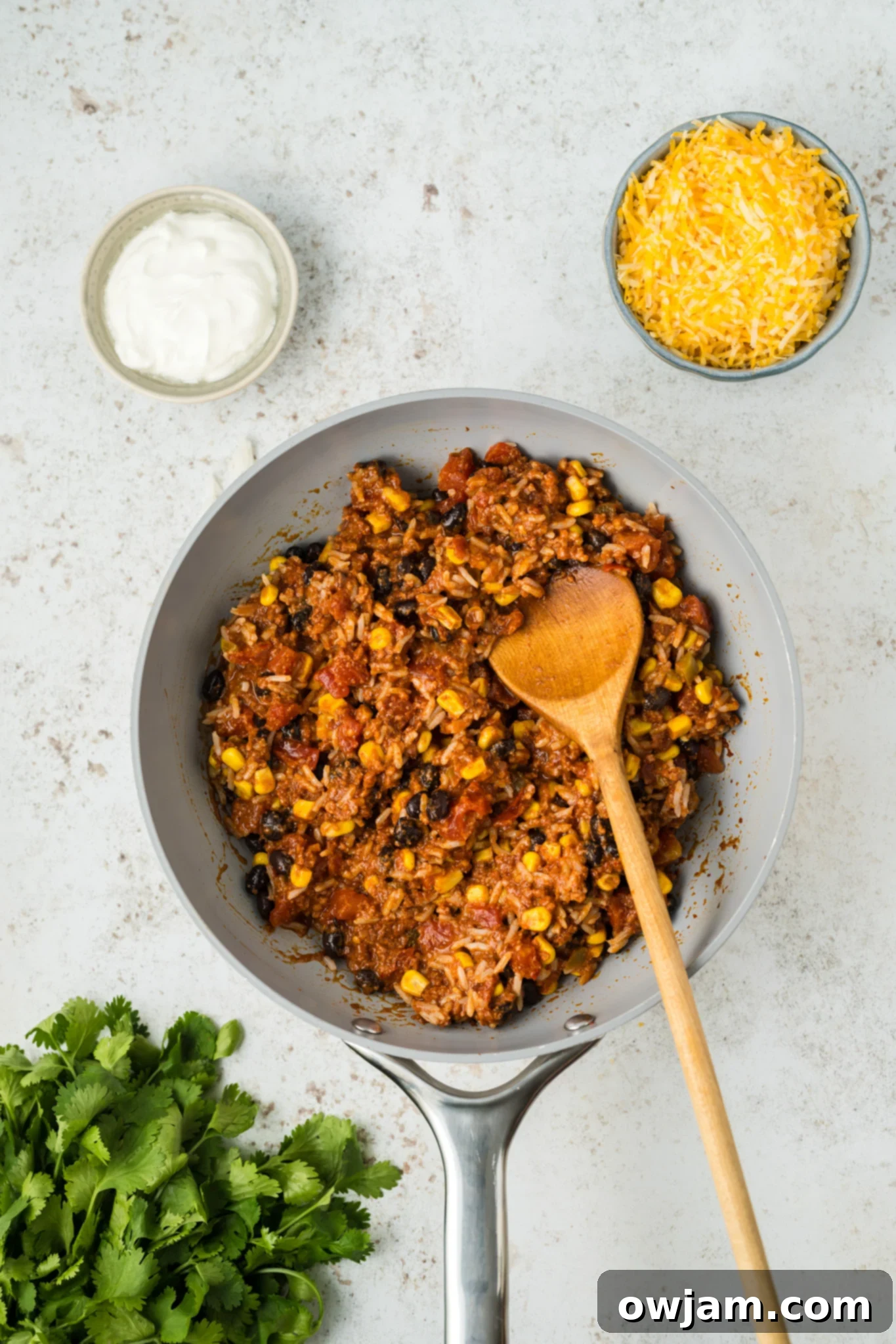 Stuffed Poblano Peppers Recipe chorizo and tomatoes in skillet.