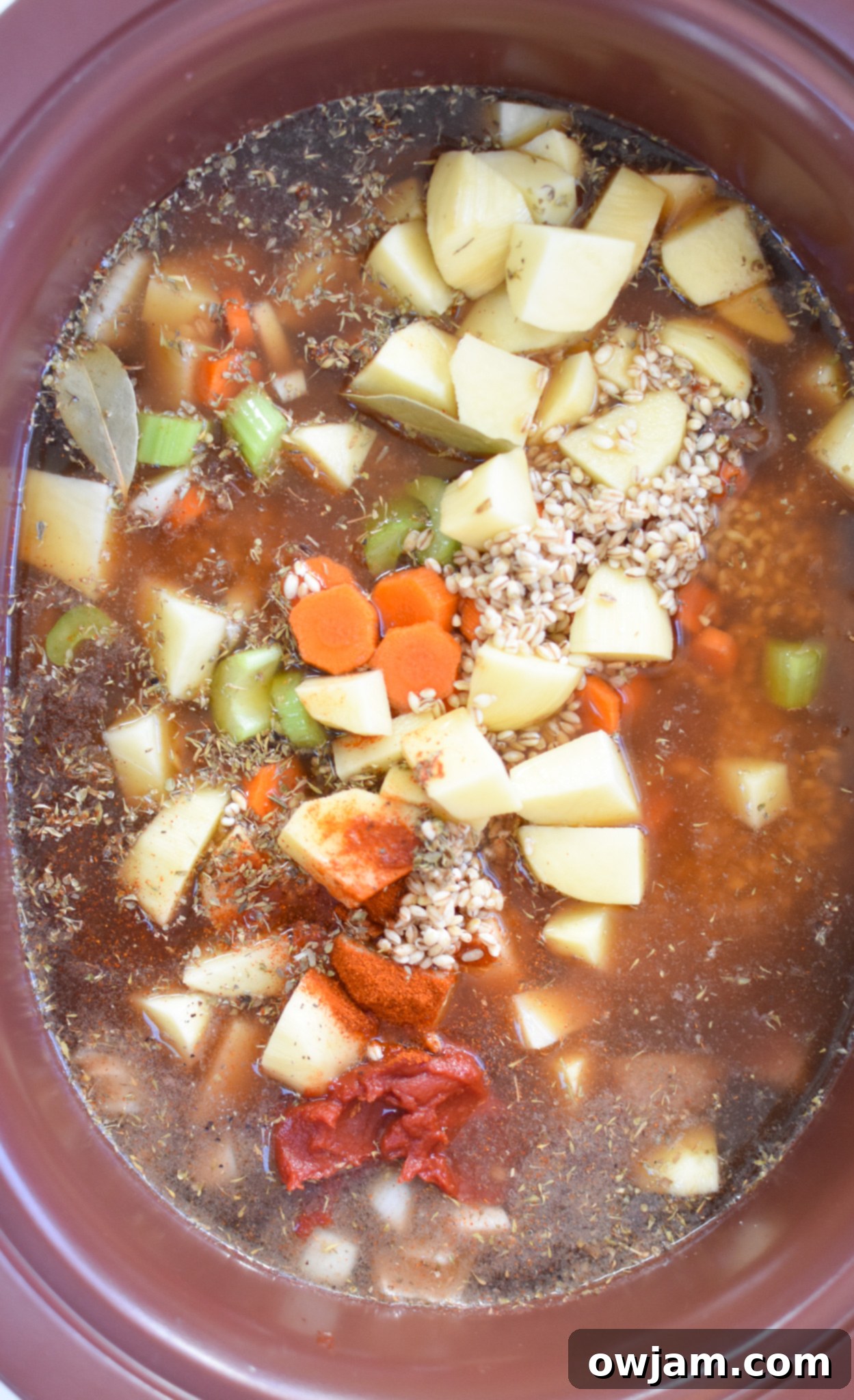 Hearty Slow Cooker Beef Barley Soup 7 All Slow Cooker Beef Barley Soup ingredients combined in a crockpot before cooking.
