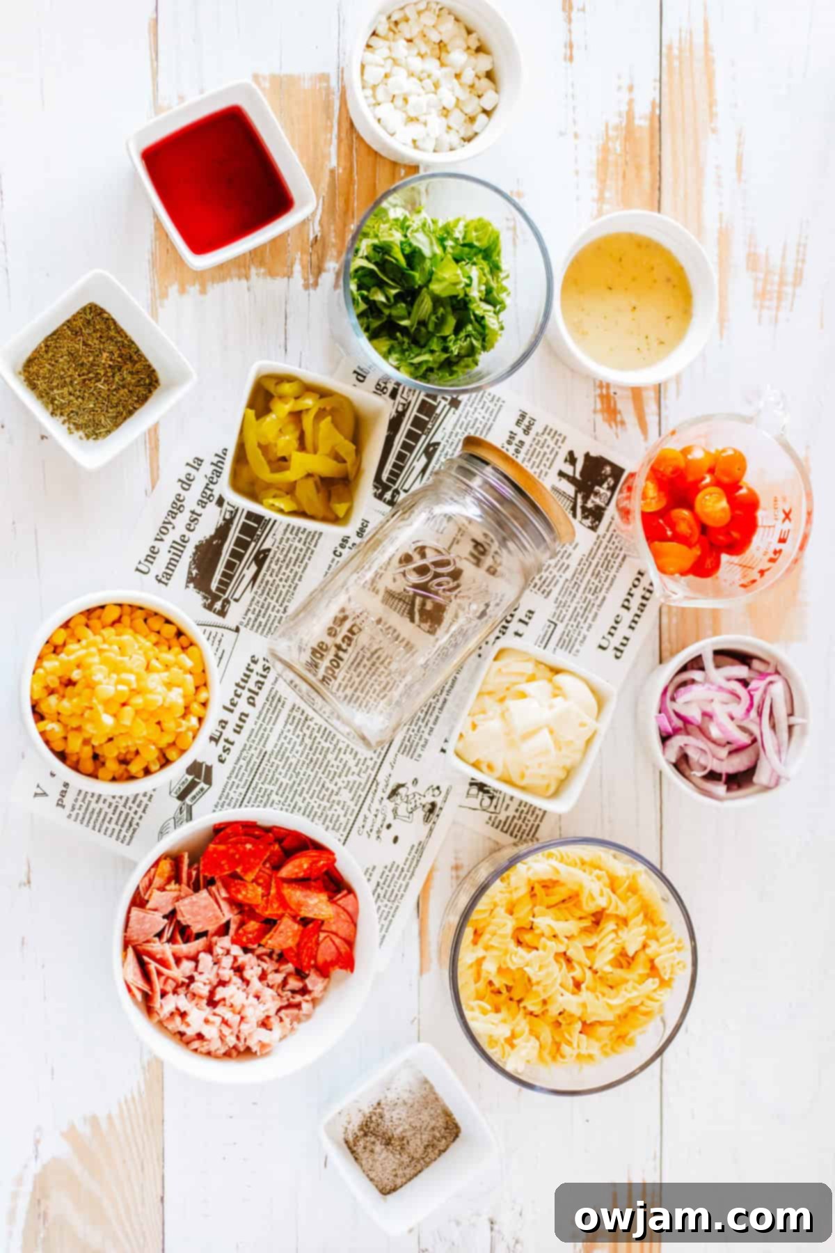 Portable Italian Pasta Salad Jar 4 Various fresh ingredients for Italian Pasta Mason Jar Salad laid out on a table.