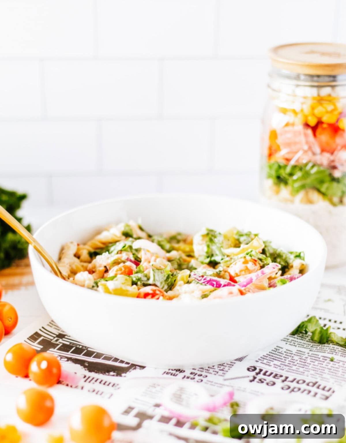 Portable Italian Pasta Salad Jar 5 Italian Pasta Mason Jar Salad served in a bowl after being shaken and poured from the jar.