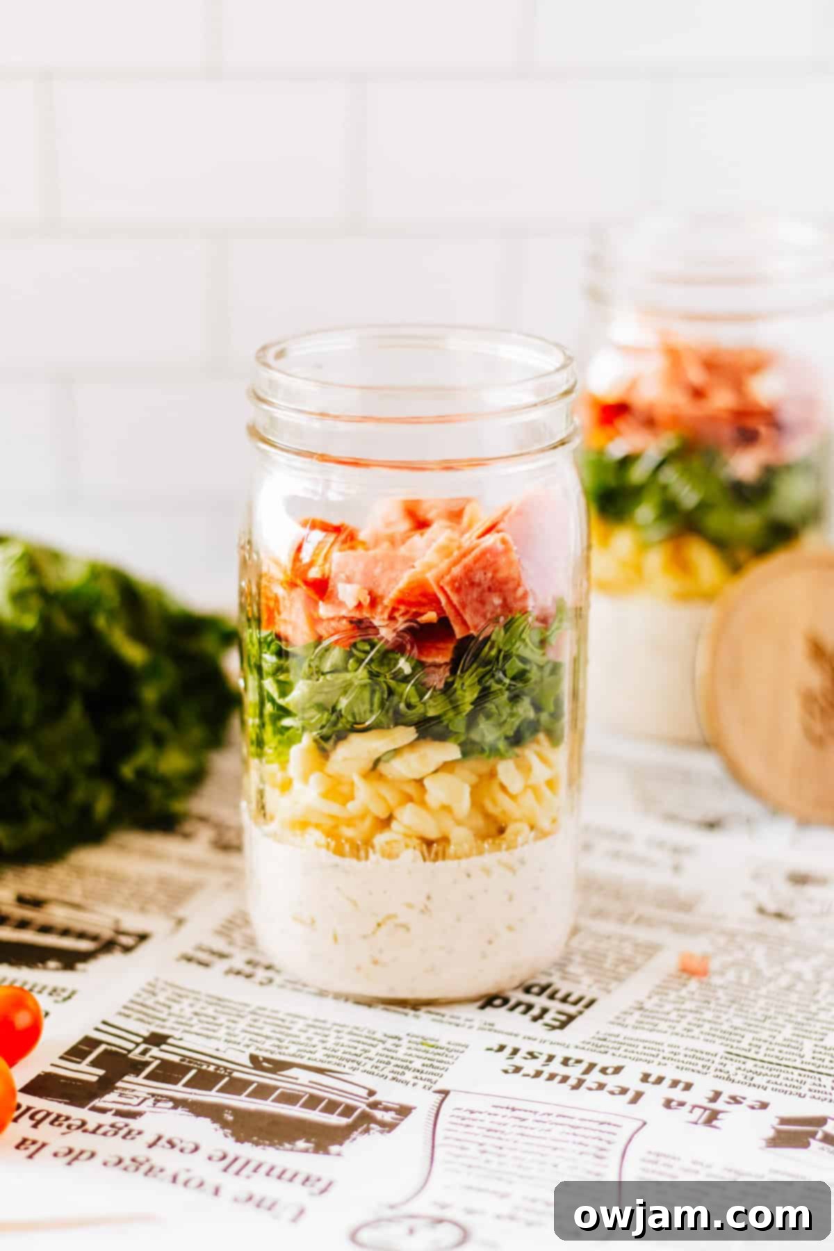 Italian Pasta Mason Jar Salad layered with all ingredients in a mason jar.