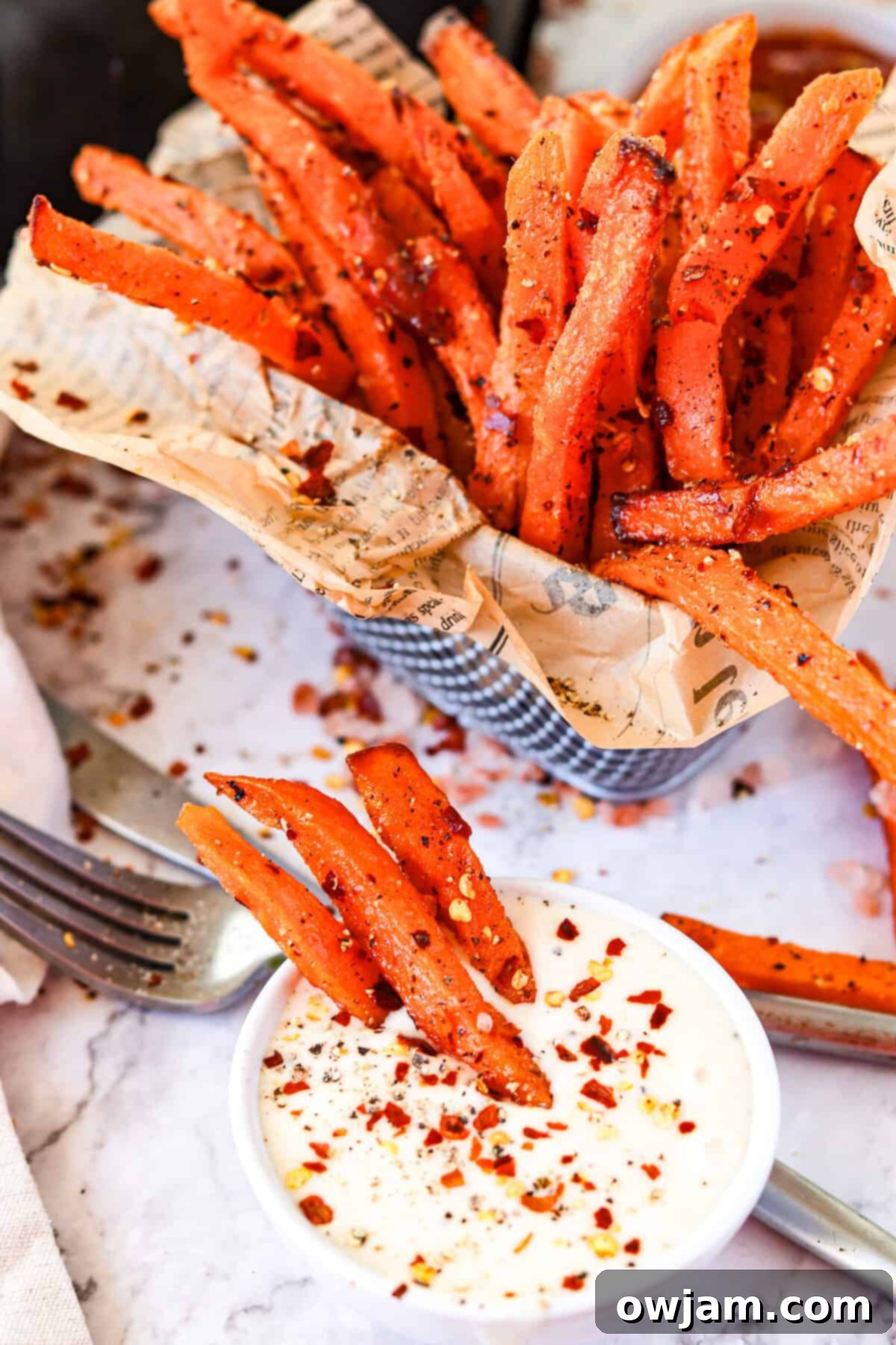 Air Fryer Sweet Potato Fries in a dip. 