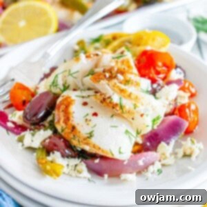 Sheet Pan Mediterranean Cod on a white bowl with fork