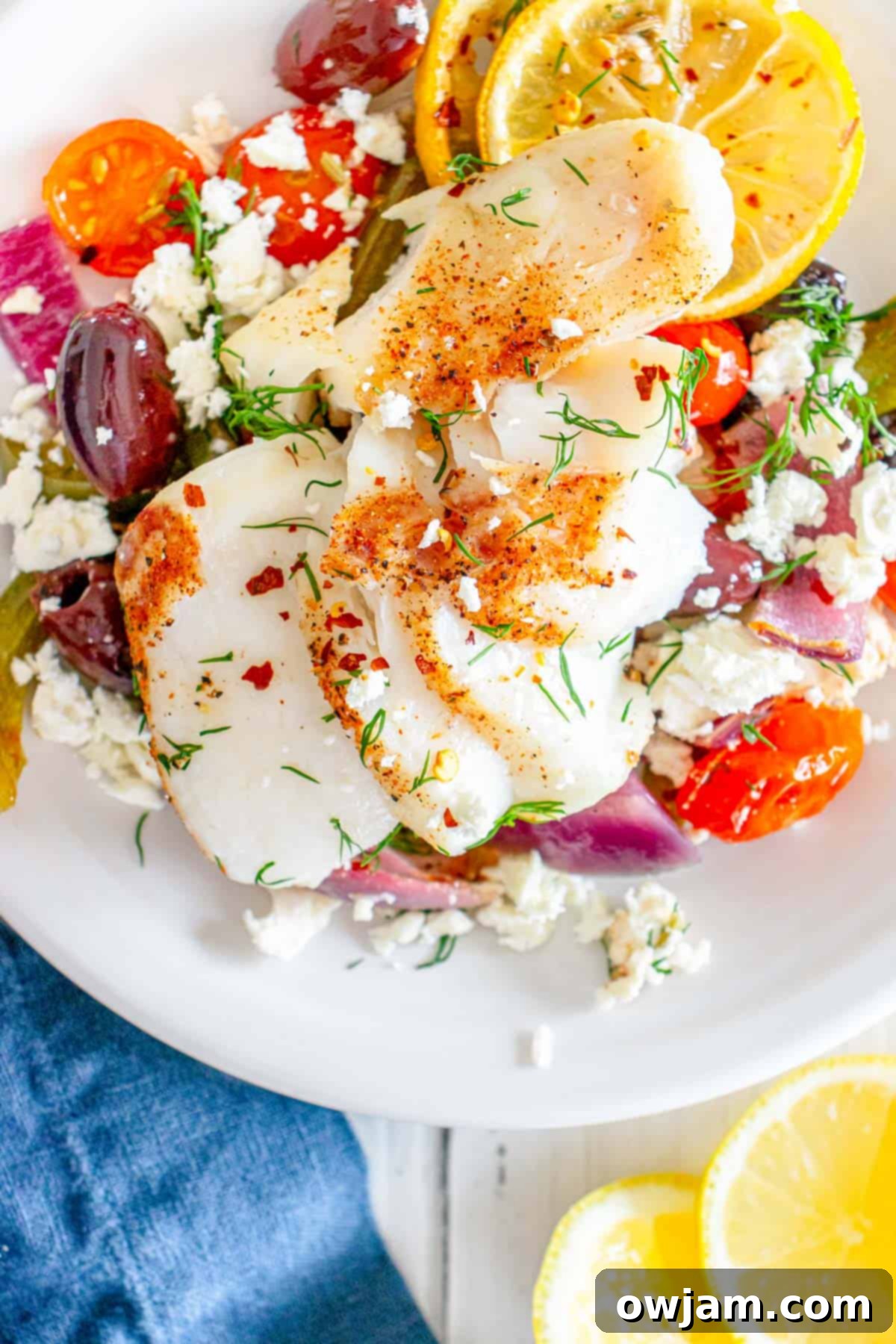 Sheet Pan Mediterranean Cod in a white bowl