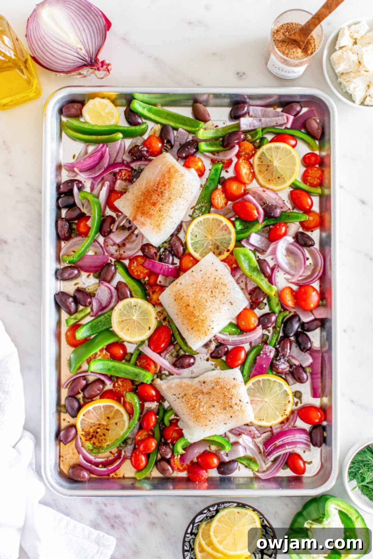 Sheet Pan Mediterranean Cod with fish on a sheet pan 