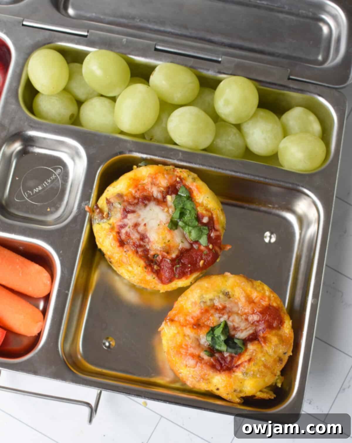 Cheesy Pizza Egg Bites 9 Pizza Egg Muffins neatly packed into a lunchbox