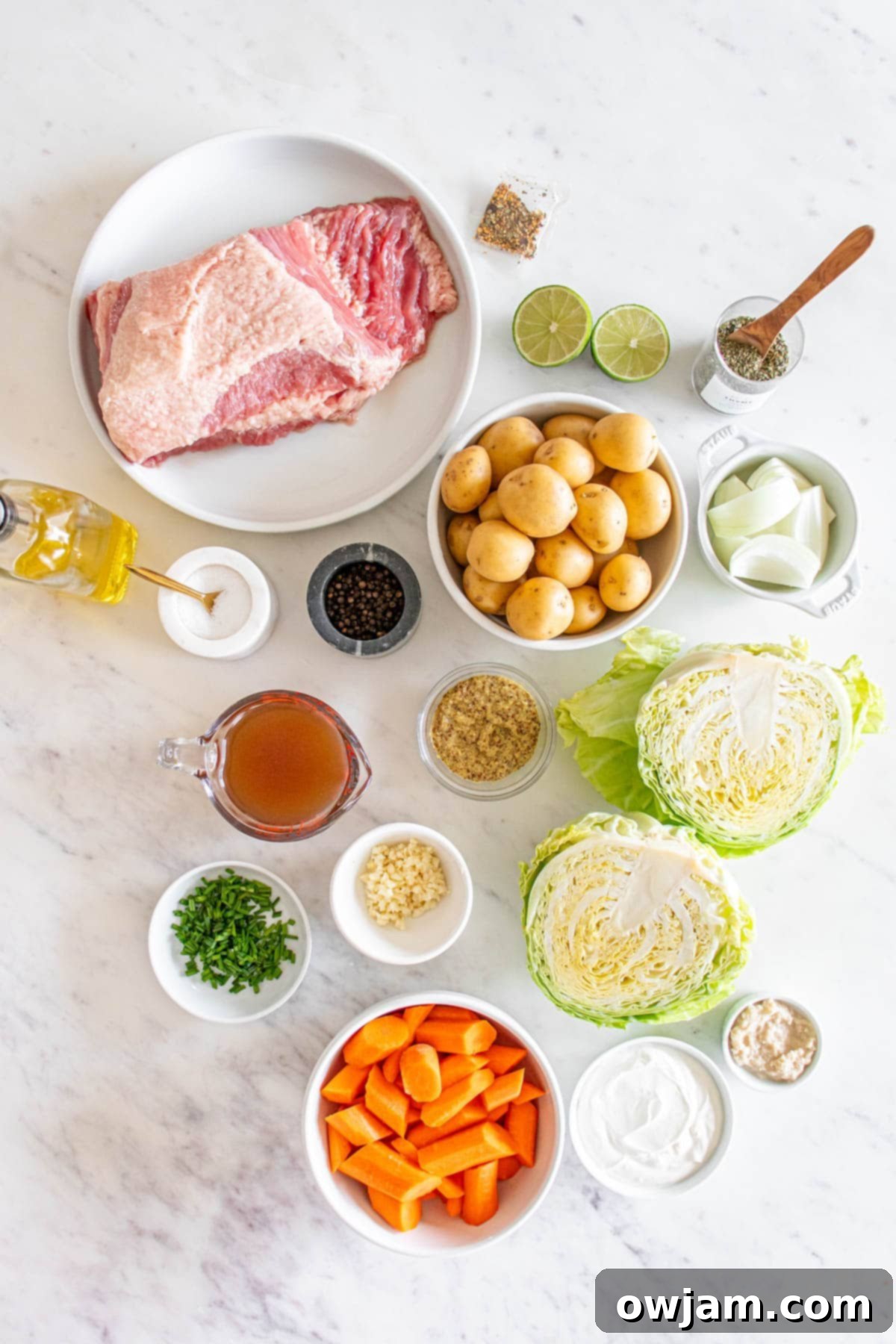 Homestyle Baked Corned Beef & Cabbage 4 Various fresh ingredients for Baked Corned Beef and Cabbage on a counter