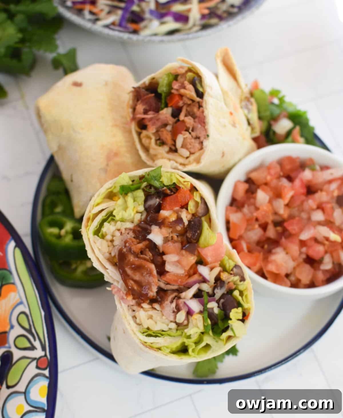Ultimate Pulled Pork Burritos 6 Pulled Pork Burritos on a white plate