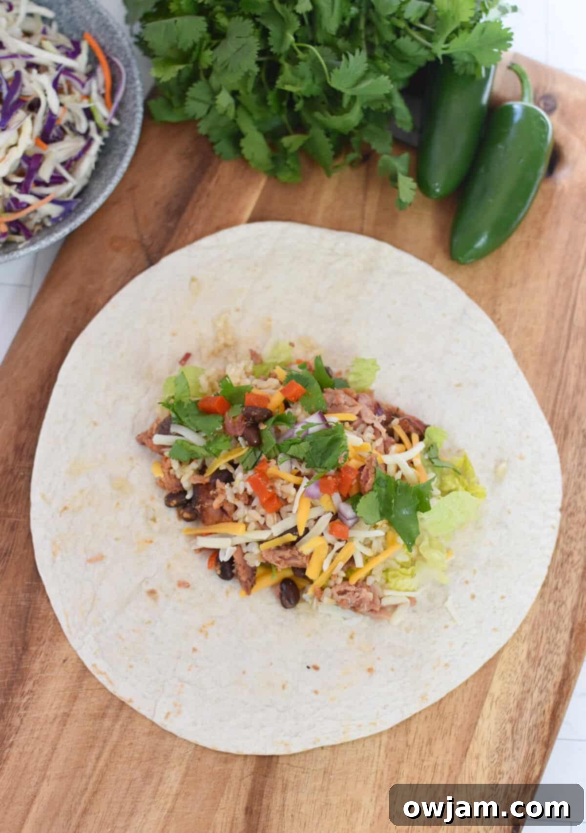 Ultimate Pulled Pork Burritos 8 Pulled Pork Burritos filling on a tortilla