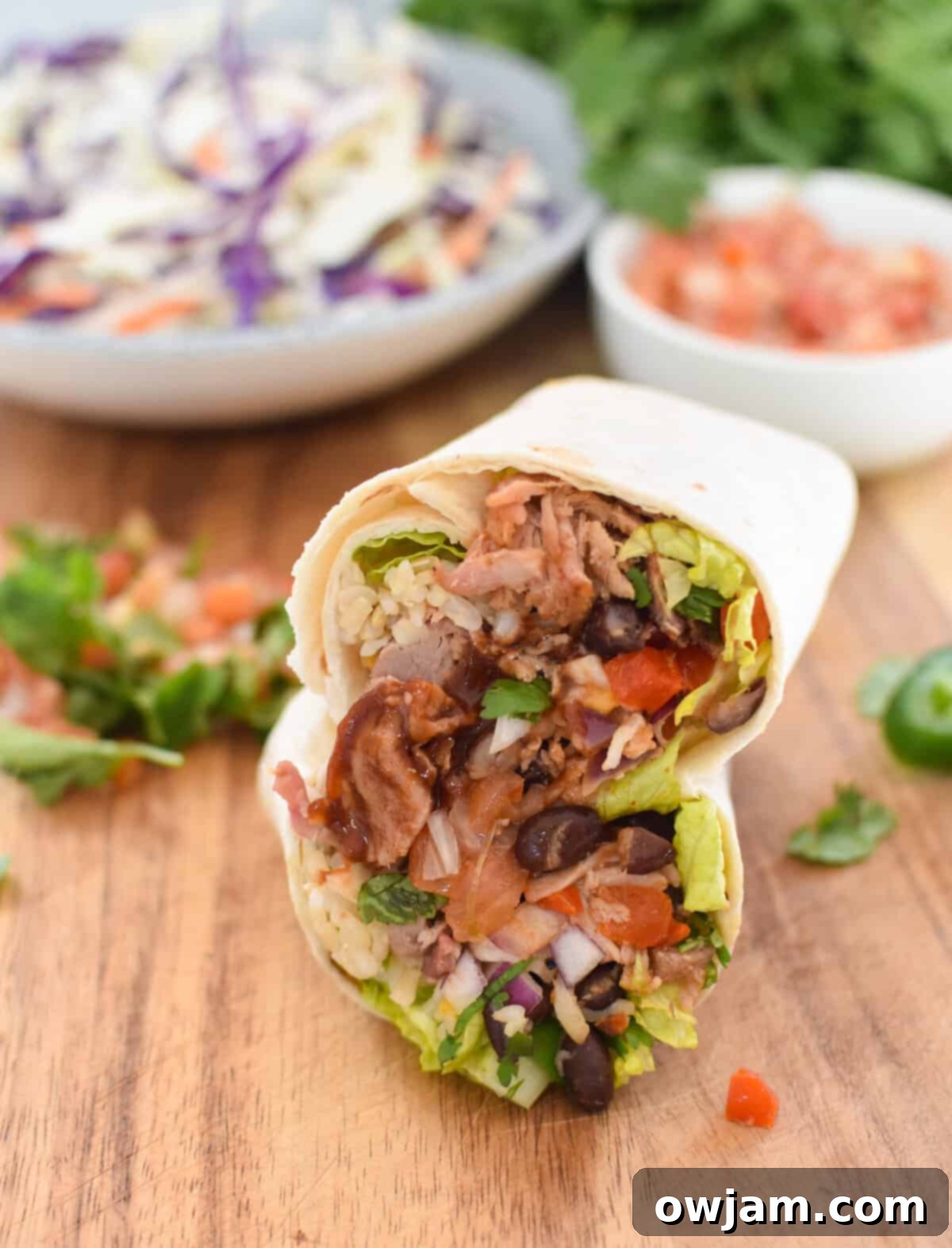 Ultimate Pulled Pork Burritos 10 Pulled Pork Burritos on a cutting board