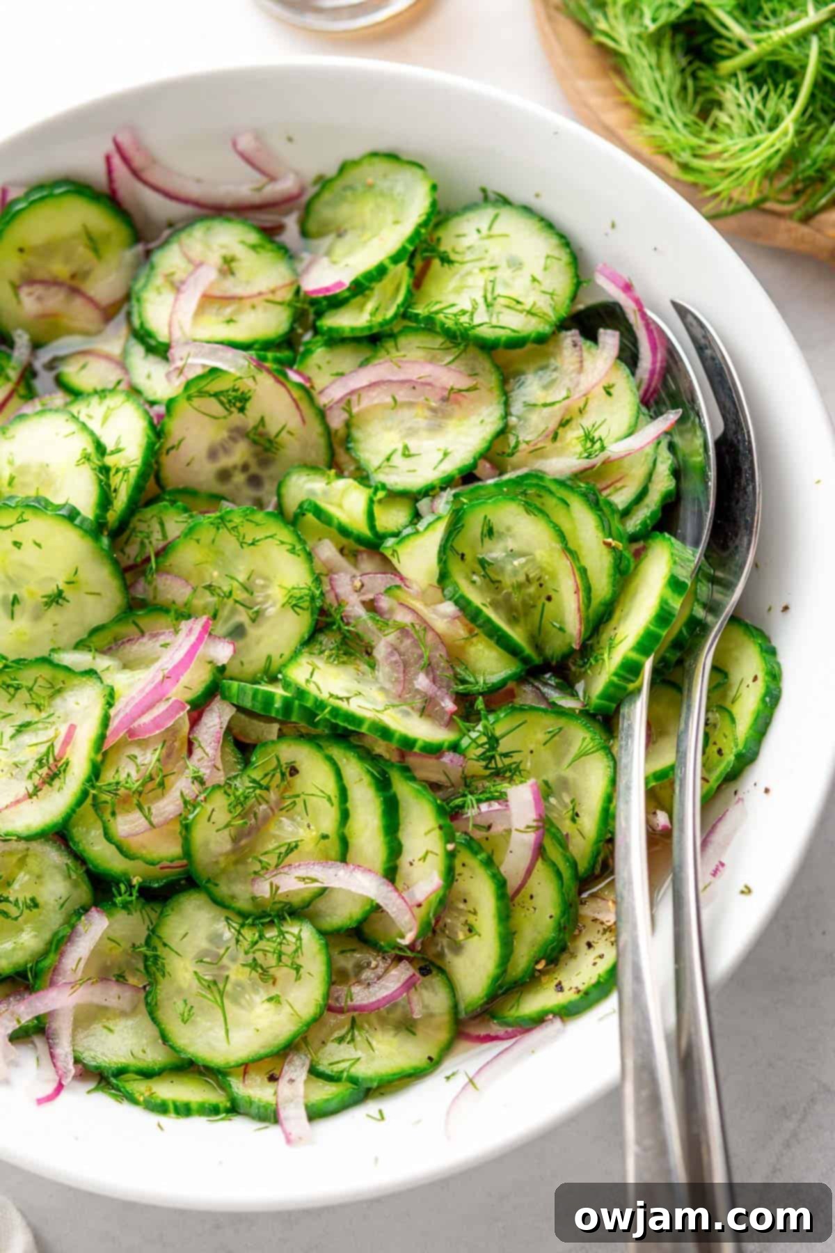 Crisp Cucumber Onion Salad in a white bowl, ready to be served