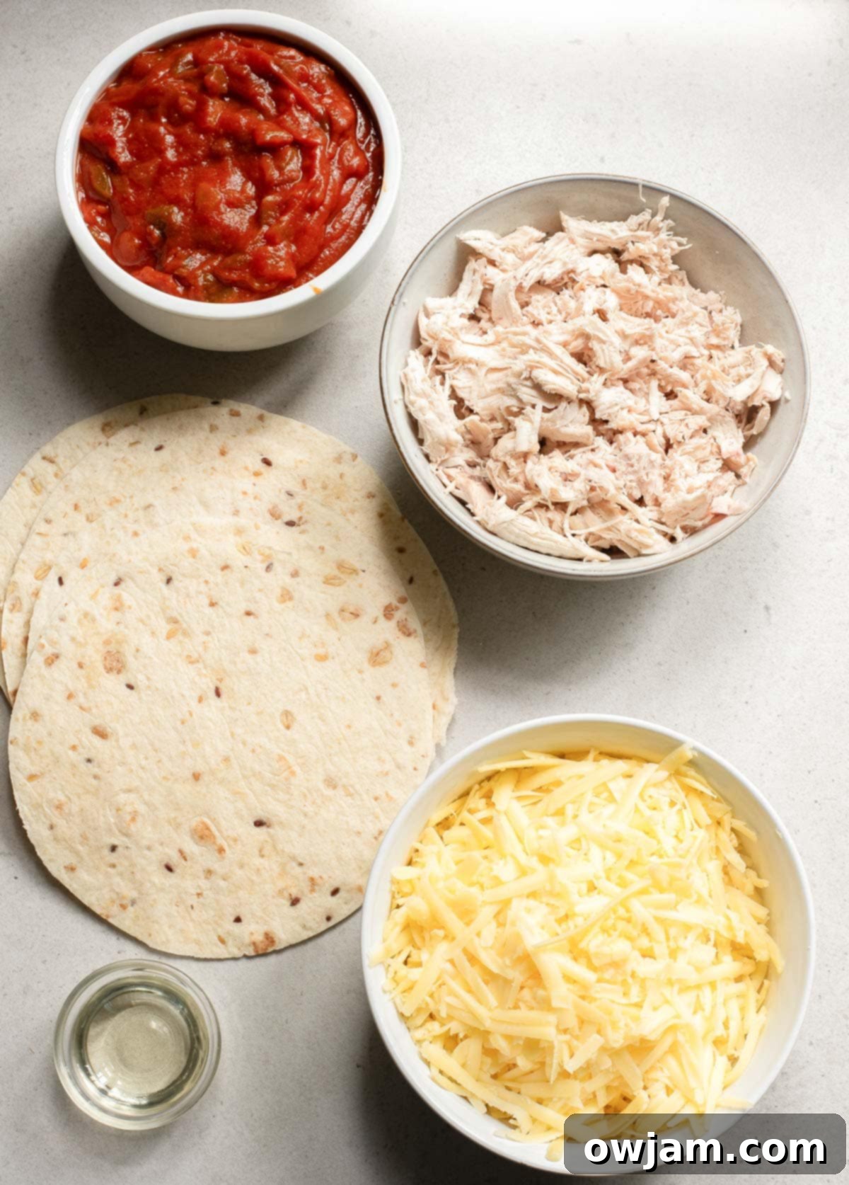 Ingredients for Baked Chicken Tacos laid out on a table