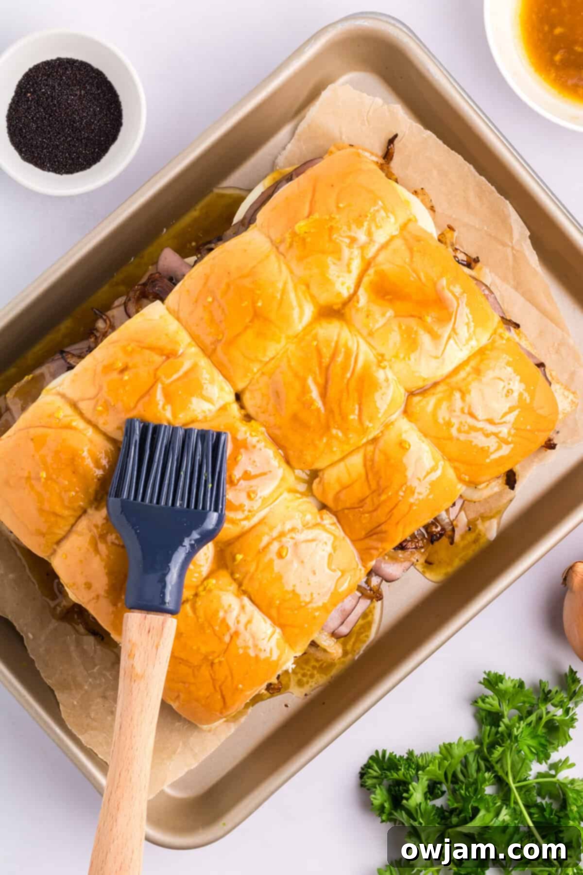 Ultimate Roast Beef Sliders 11 Roast Beef Sliders butter on rolls.