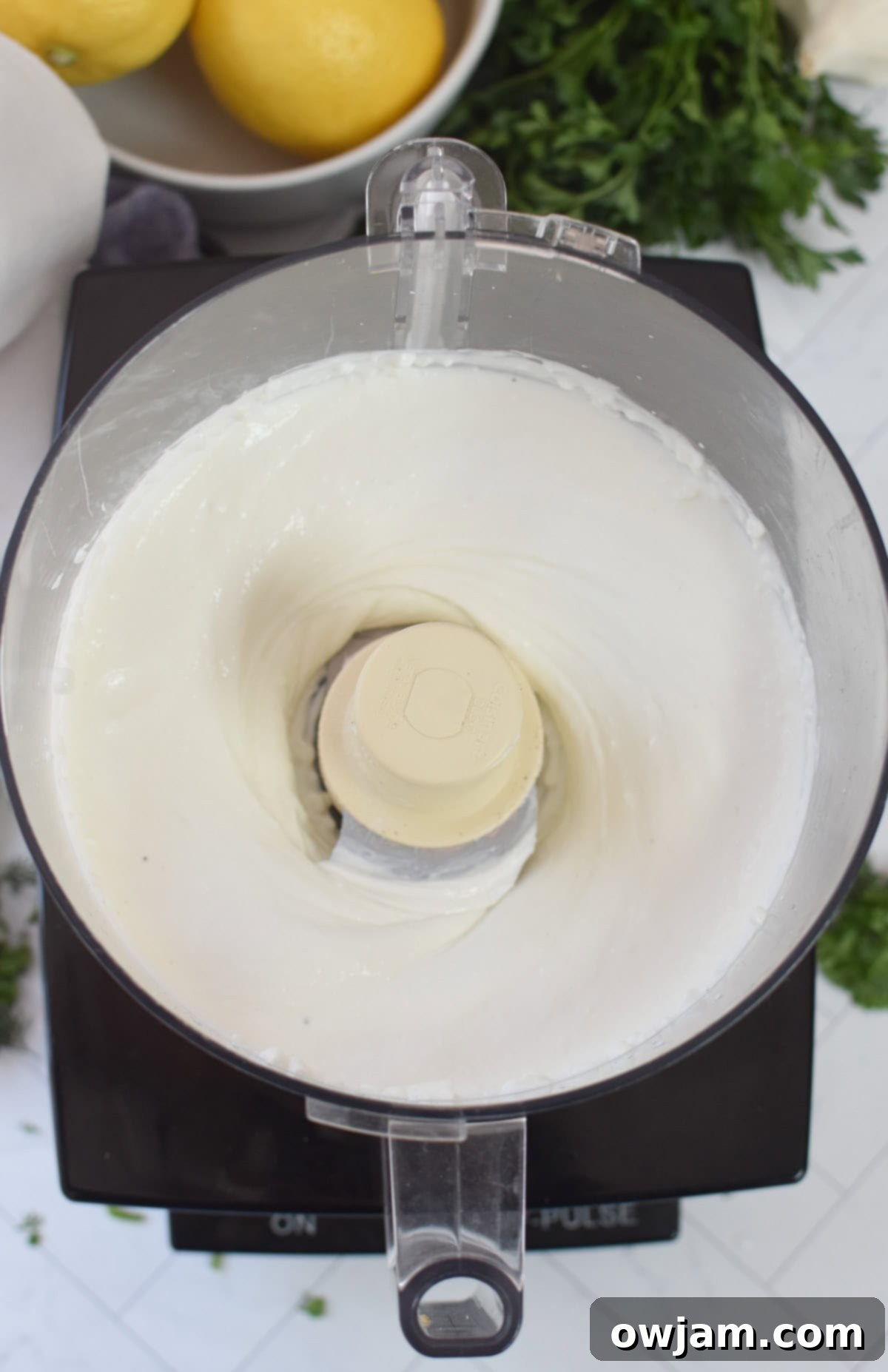 Velvety Cottage Cheese 7 Whipped Cottage Cheese being blended to a smooth consistency in a food processor