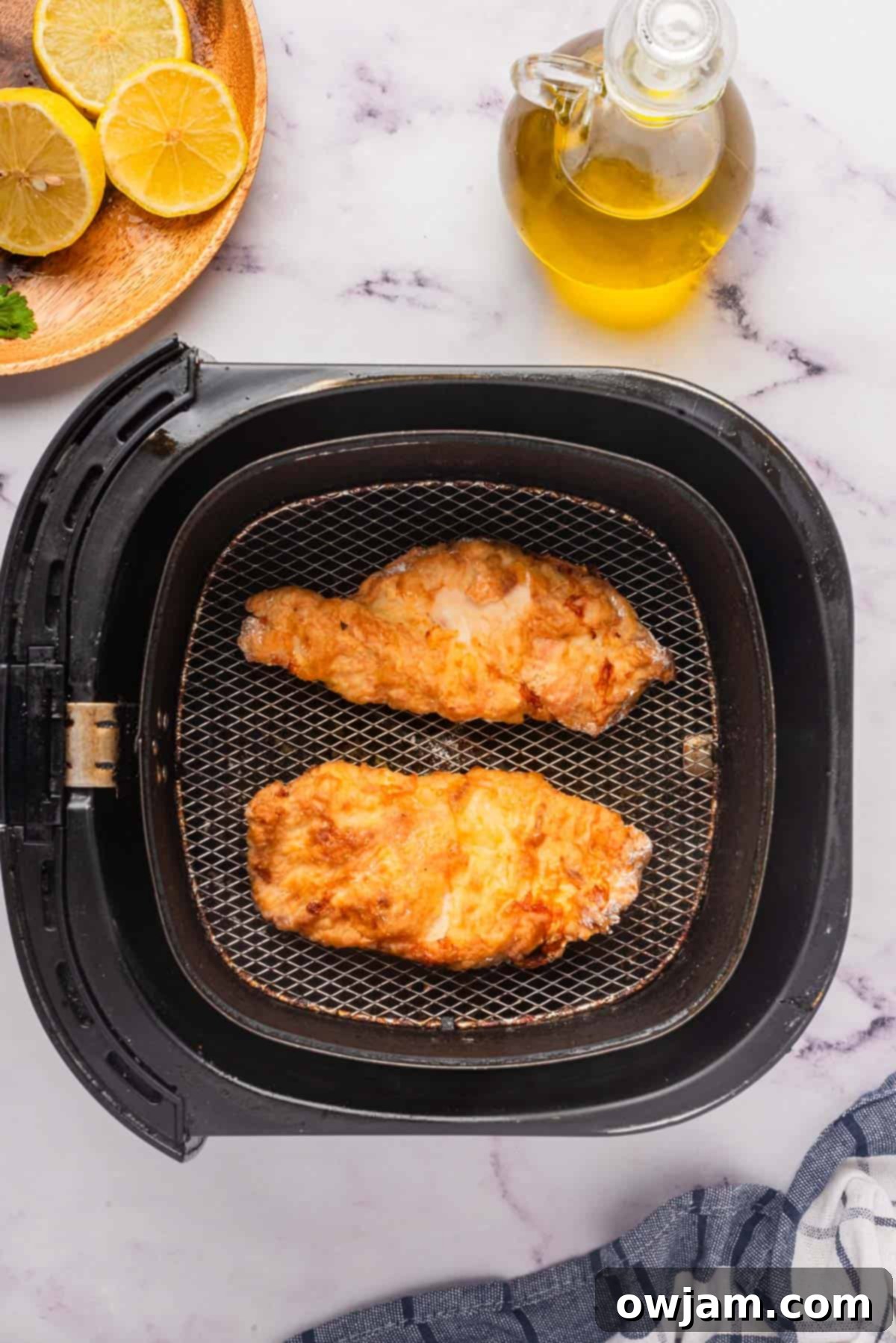 Air Fryer Chicken Breast resting on a cutting board