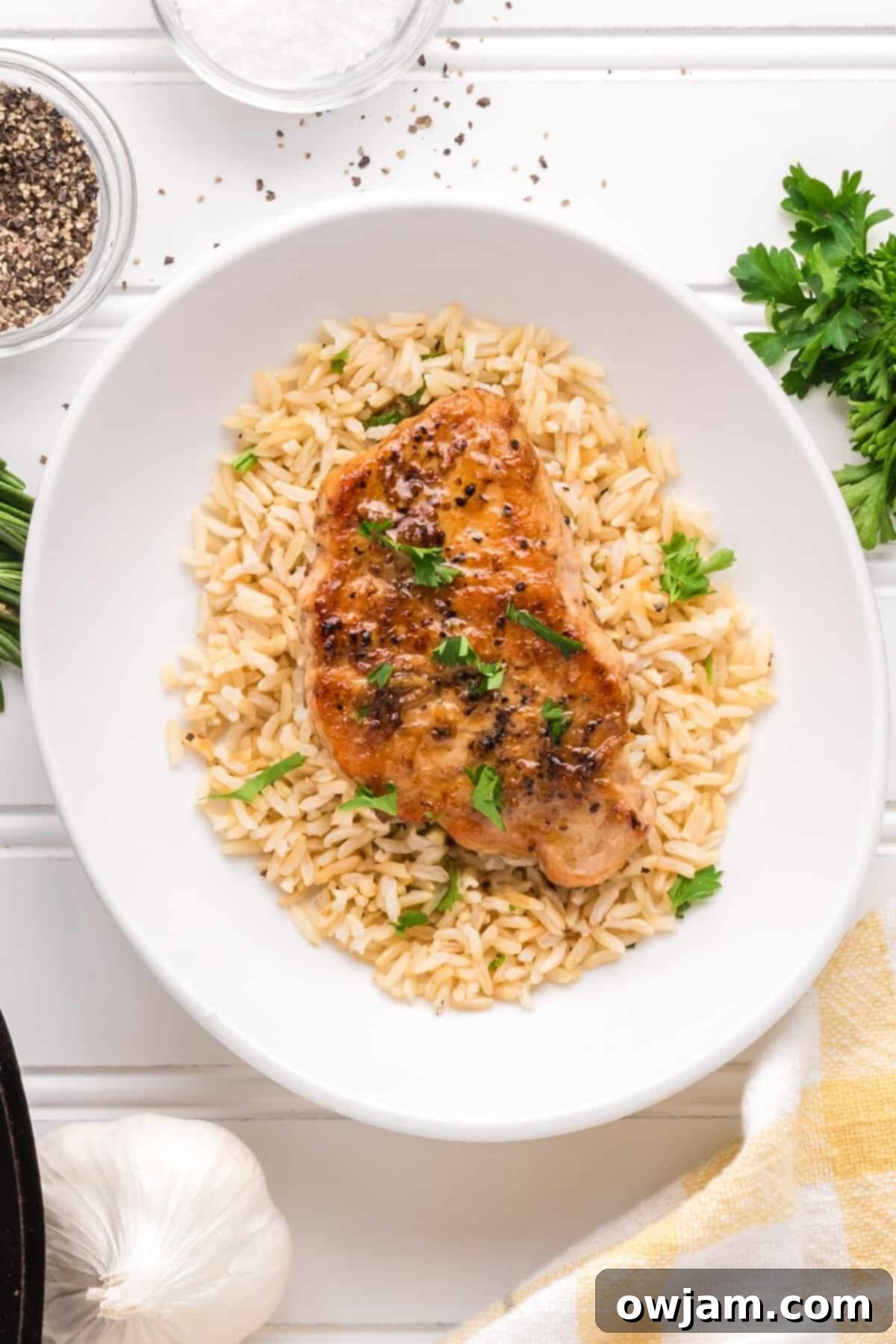 Pan Seared Pork Chops on a white plate