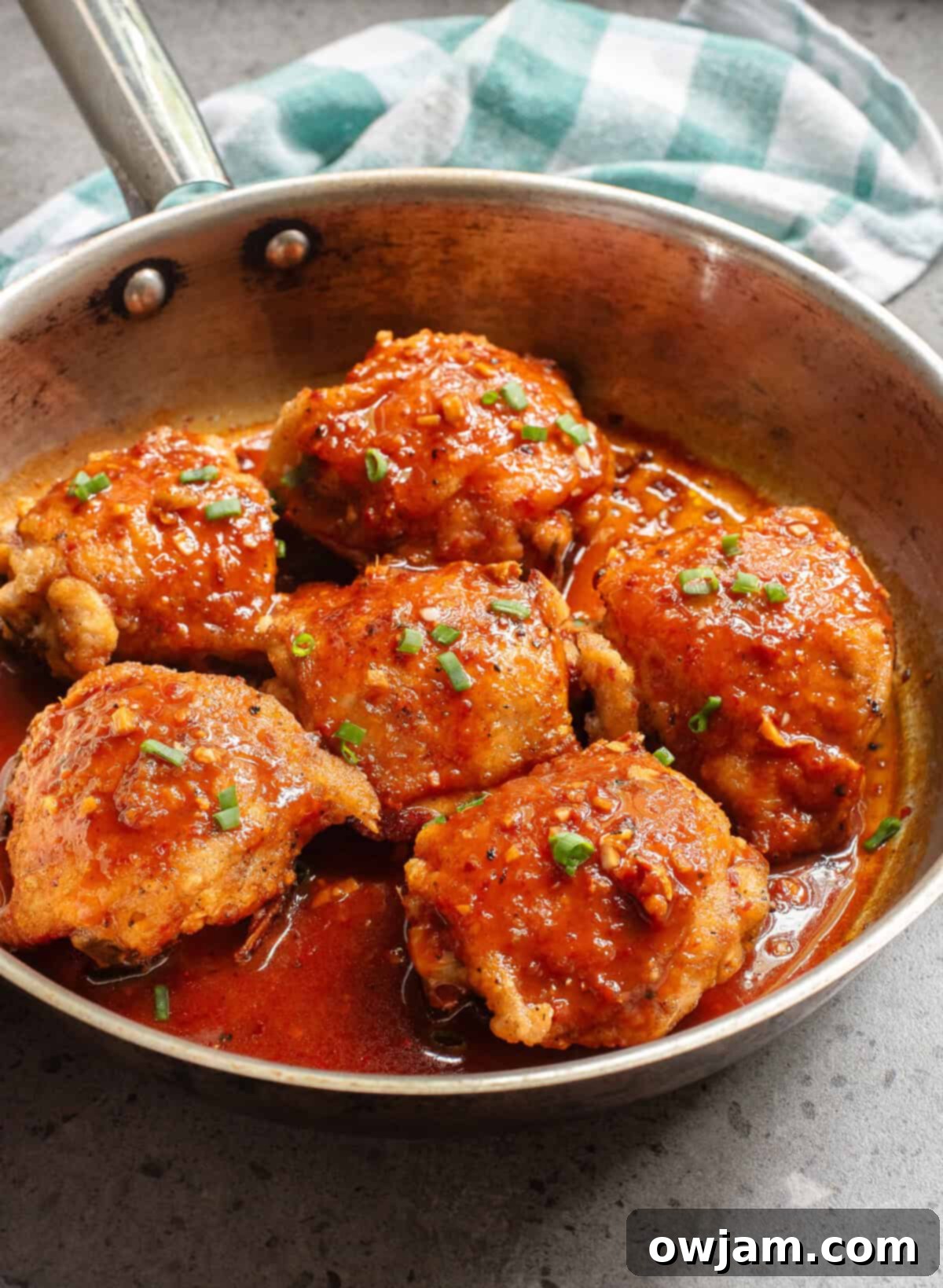 Sticky Honey Ginger Chicken 5 Honey Ginger Chicken in a skillet with sauce