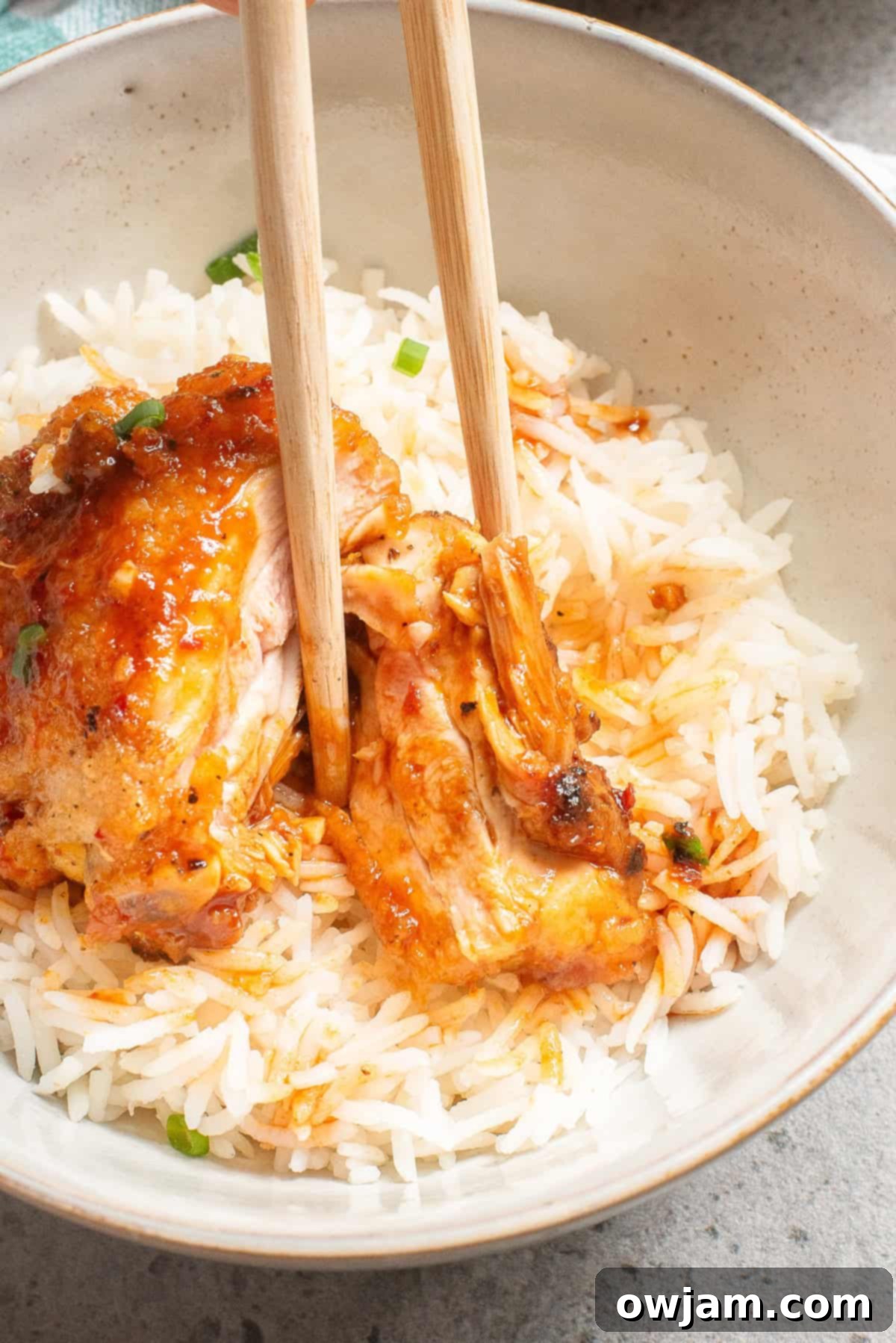 Sticky Honey Ginger Chicken 8 Honey Ginger Chicken with chopsticks in a bowl