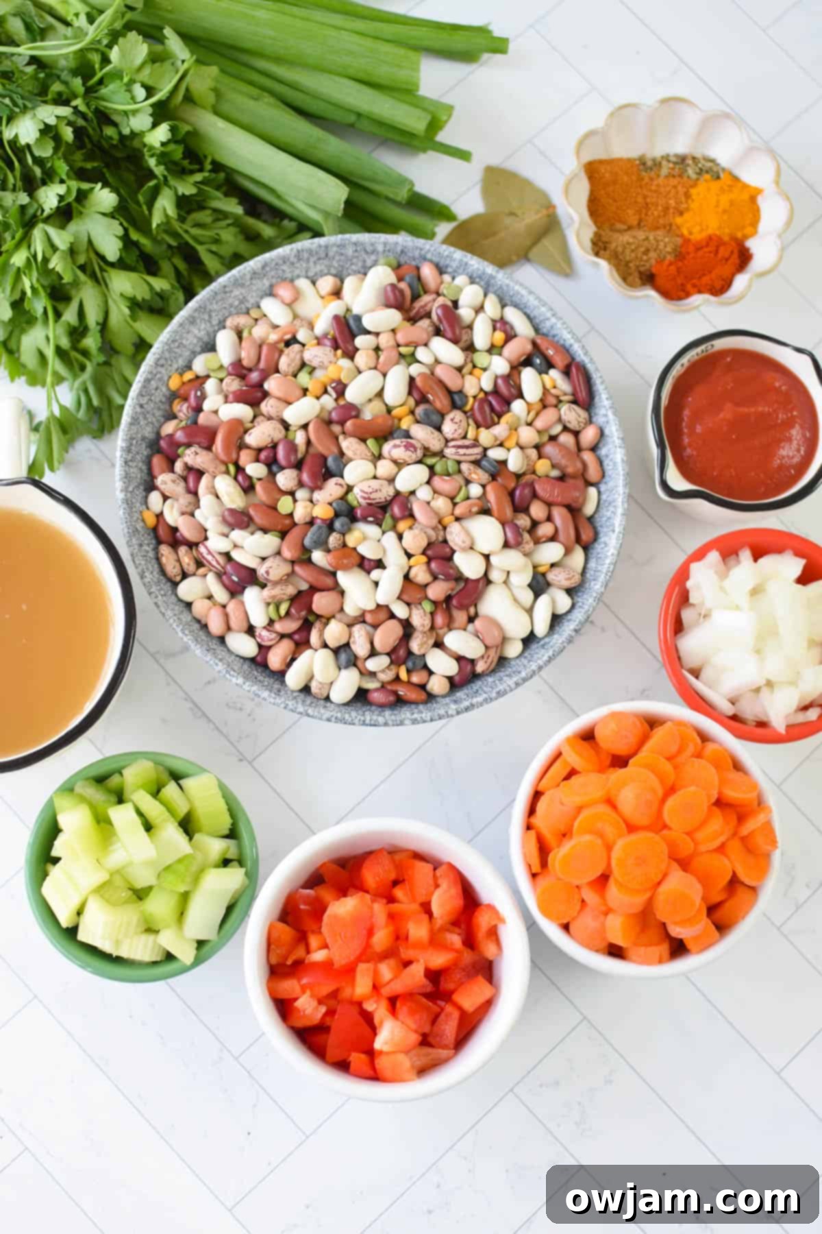 Various fresh ingredients for Instant Pot 15 Bean Soup laid out on a table.