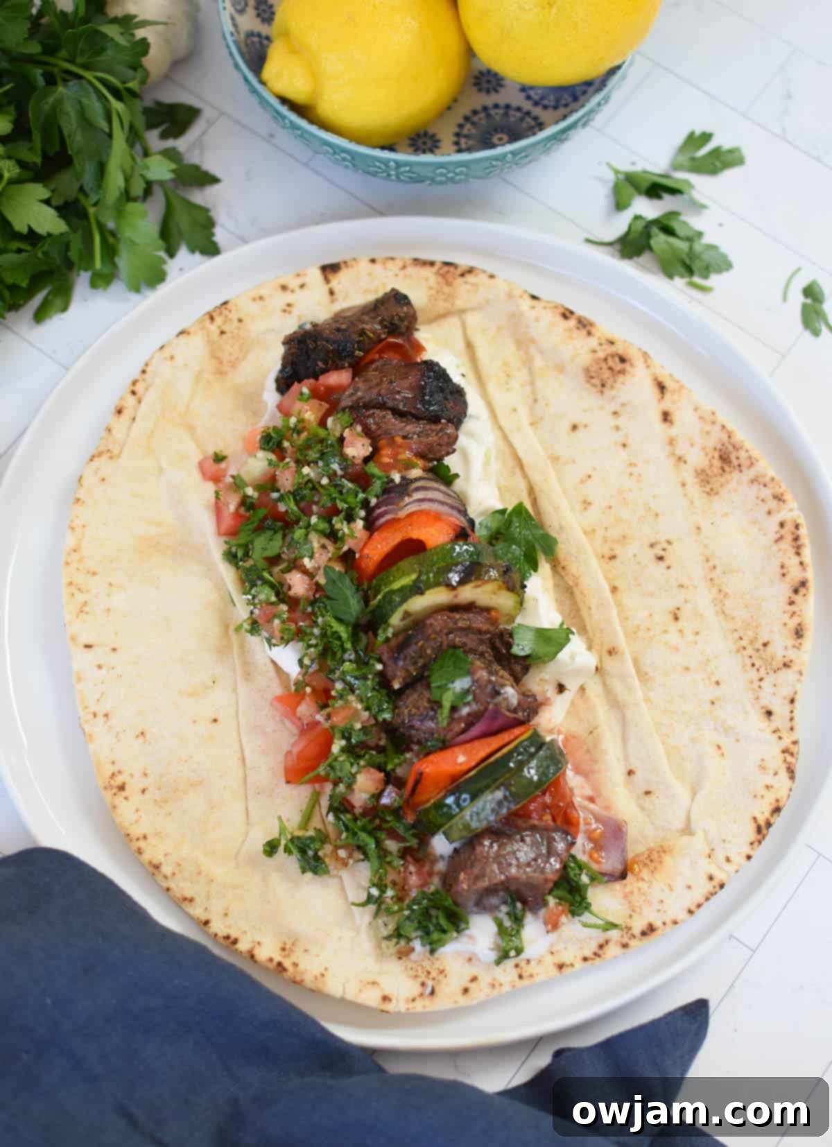 Authentic Greek Beef Souvlaki 7 Beef Souvlaki served in a pita bread with tzatziki and vegetables