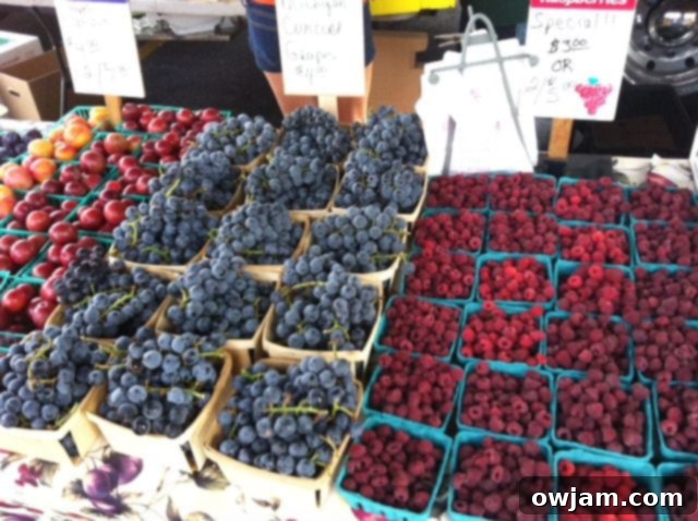 Vibrant assortment of fresh berries and produce from a farmers market
