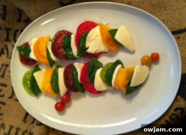 Plated Heirloom Caprese Salad, a beautiful and tasty creation from A Cedar Spoon