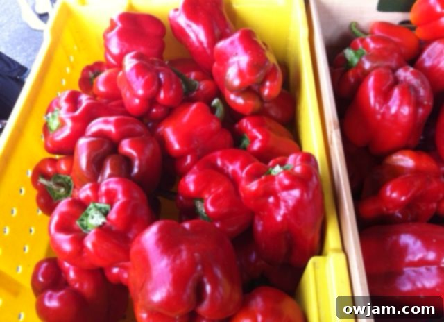 Colorful bell peppers, perfect for a fresh salad, alongside Heirloom Caprese Salad ingredients