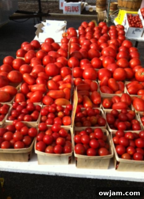 Pile of rich red tomatoes, fresh from the farm, ready for an Heirloom Caprese Salad