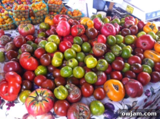 Beautiful heirloom tomatoes of various colors, the star of any Heirloom Caprese Salad