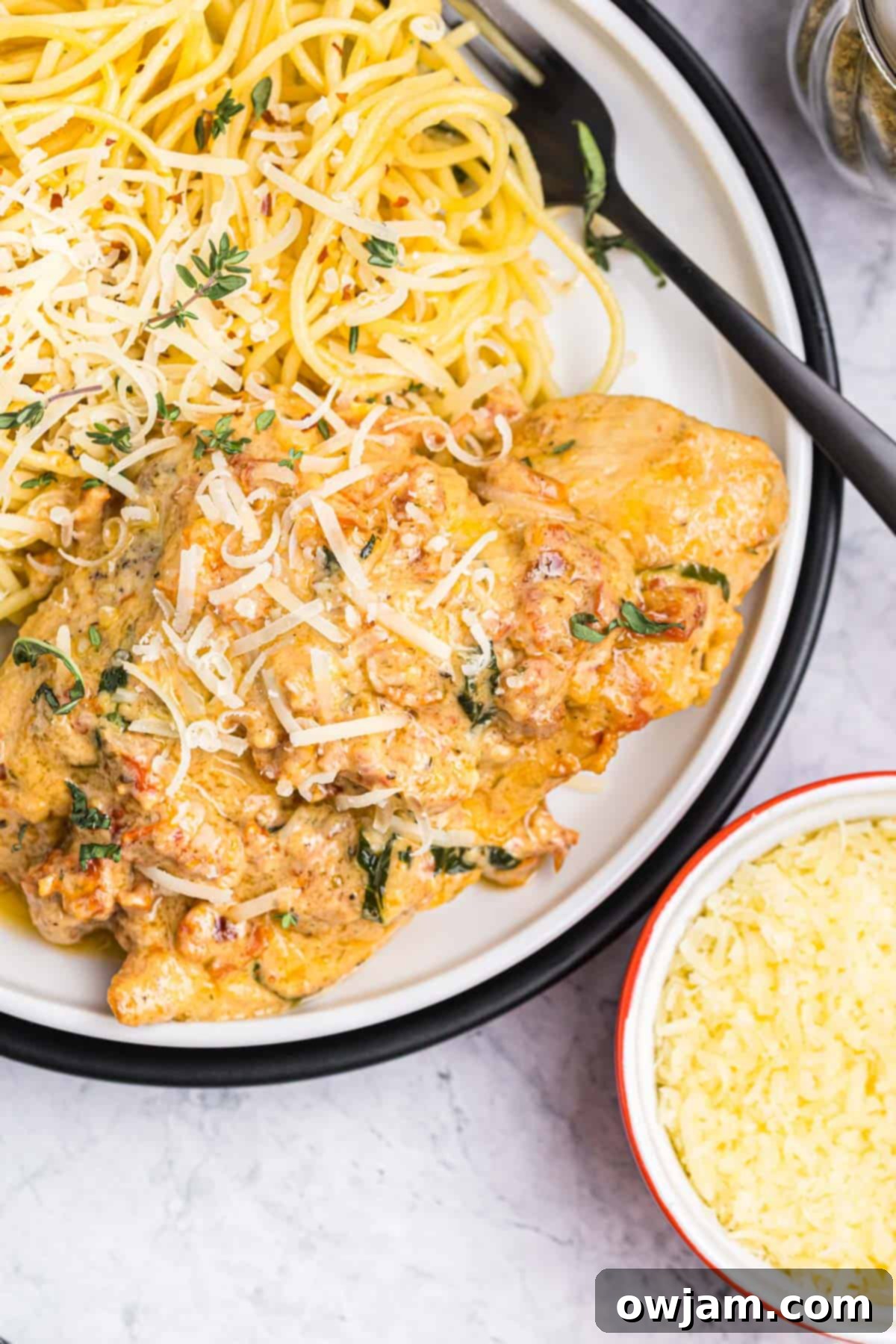 Marry Me Chicken on a plate, garnished with fresh herbs, showcasing the rich, creamy sauce and tender chicken.