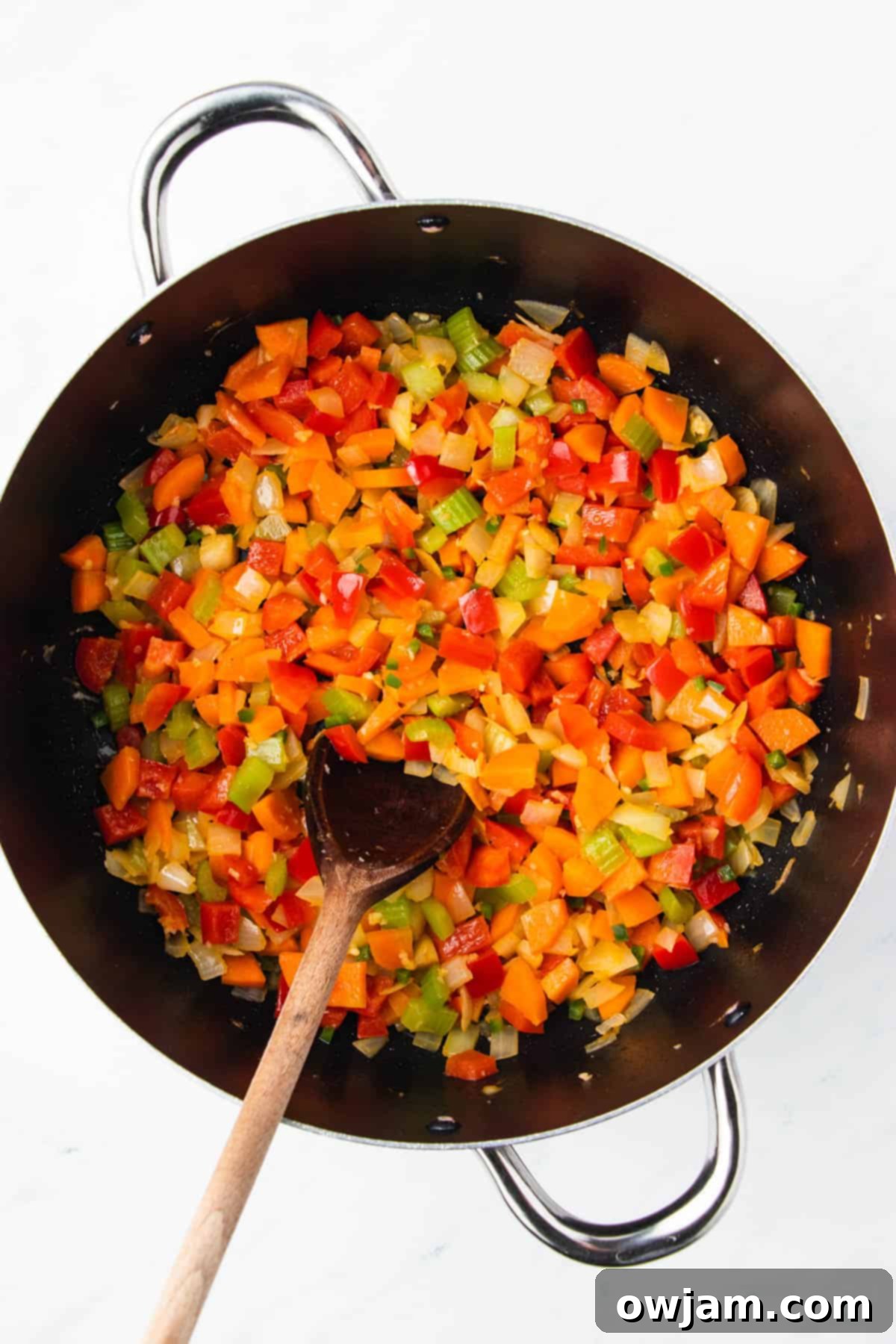 Mexican Lentil Soup 6 Sautéed vegetables and spices cooking in a skillet for Mexican Lentil Soup.