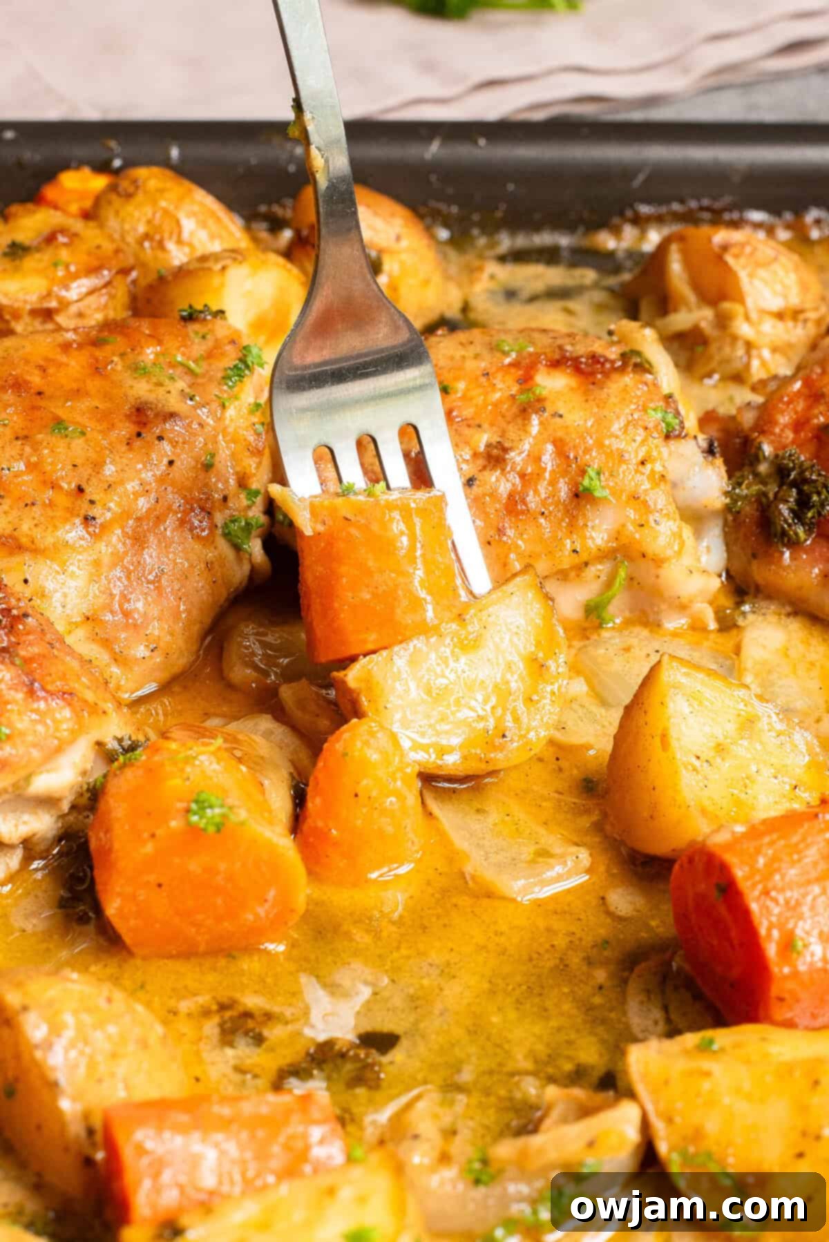 Easy Sheet Pan Honey Mustard Chicken Thighs 9 Sheet Pan Honey Mustard Chicken Thighs with fork