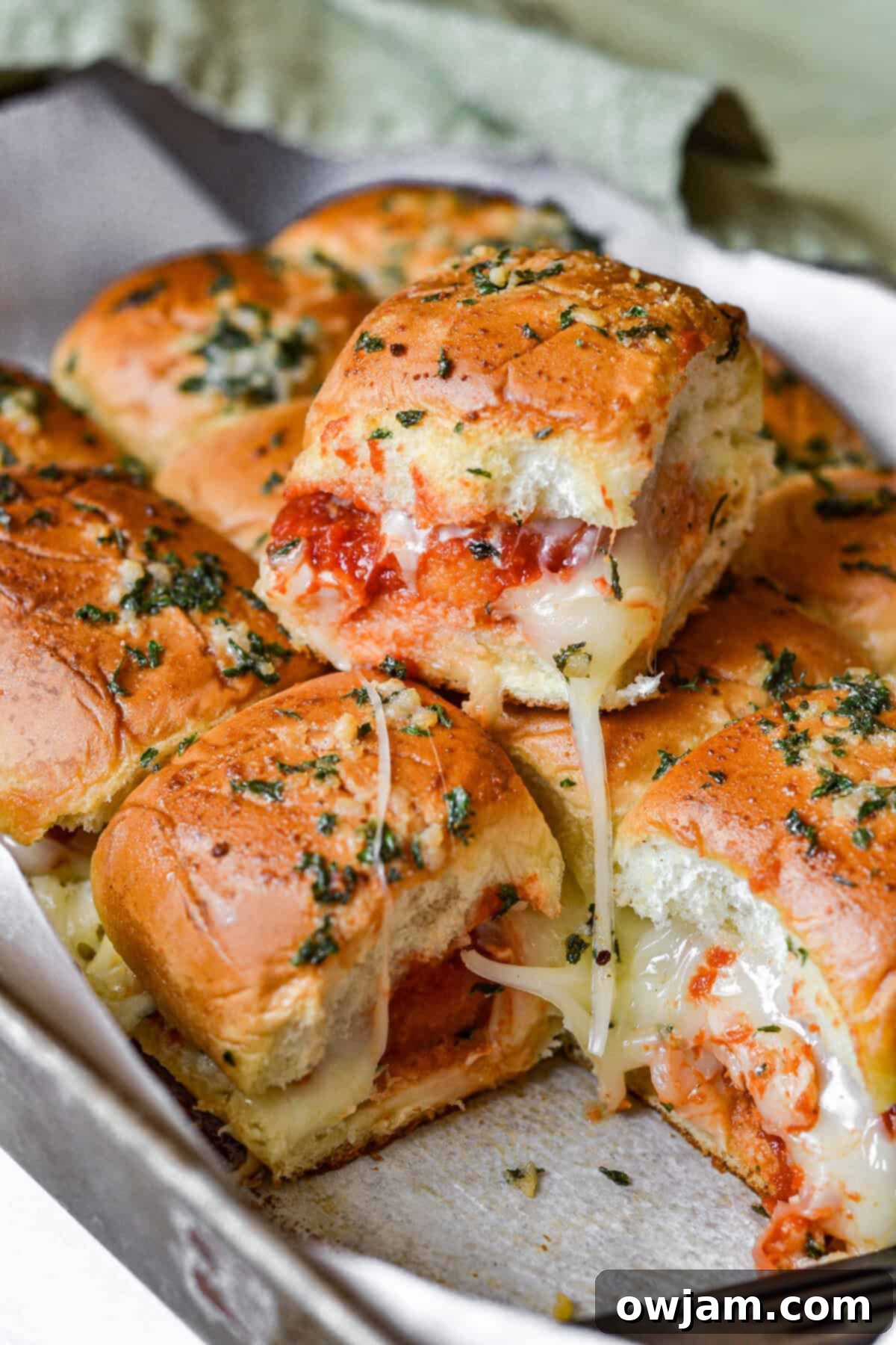Speedy Chicken Parm Bites 13 Easy Chicken Parmesan Sliders on a baking sheet