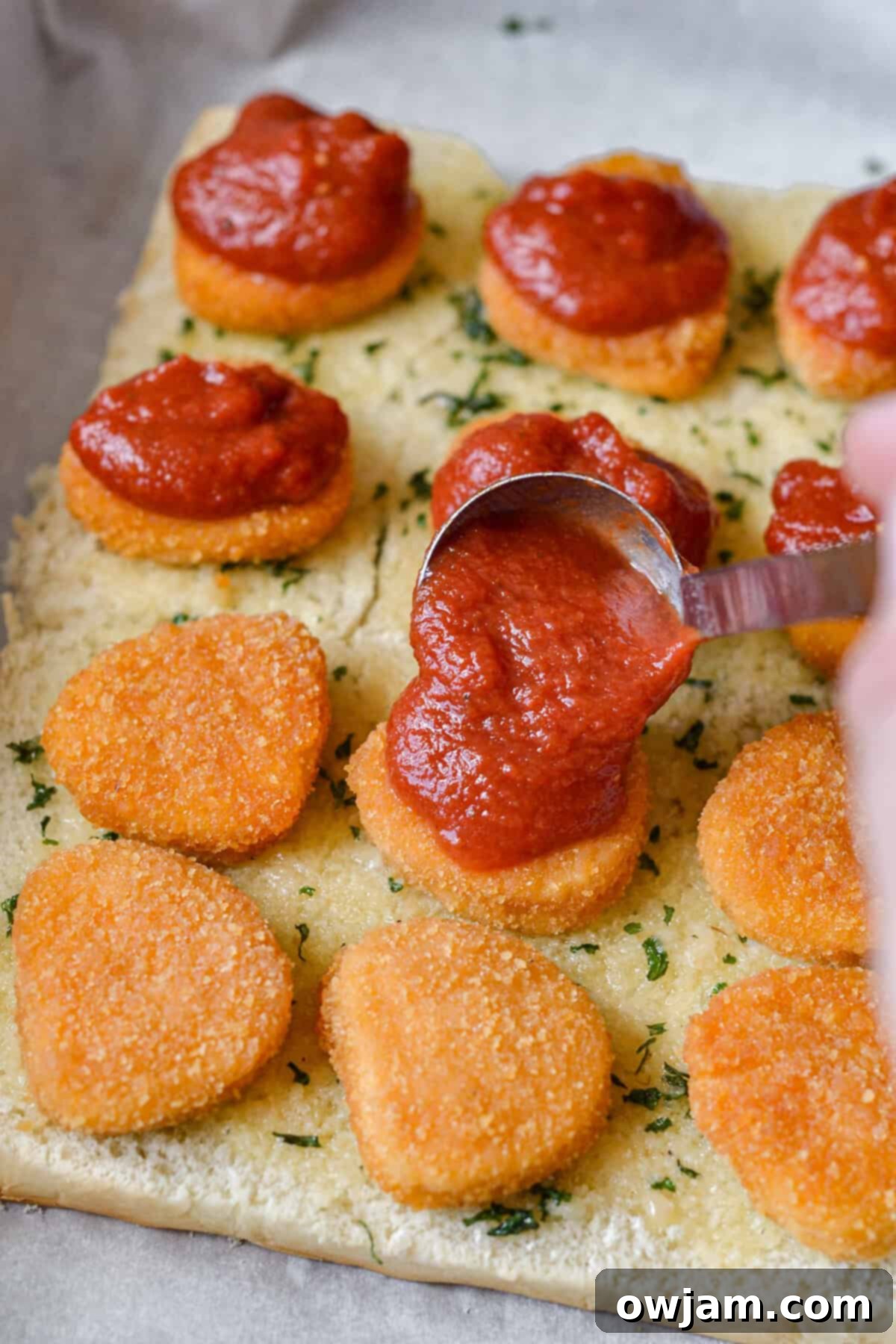 Speedy Chicken Parm Bites 9 Easy Chicken Parmesan Sliders with sauce going on chicken
